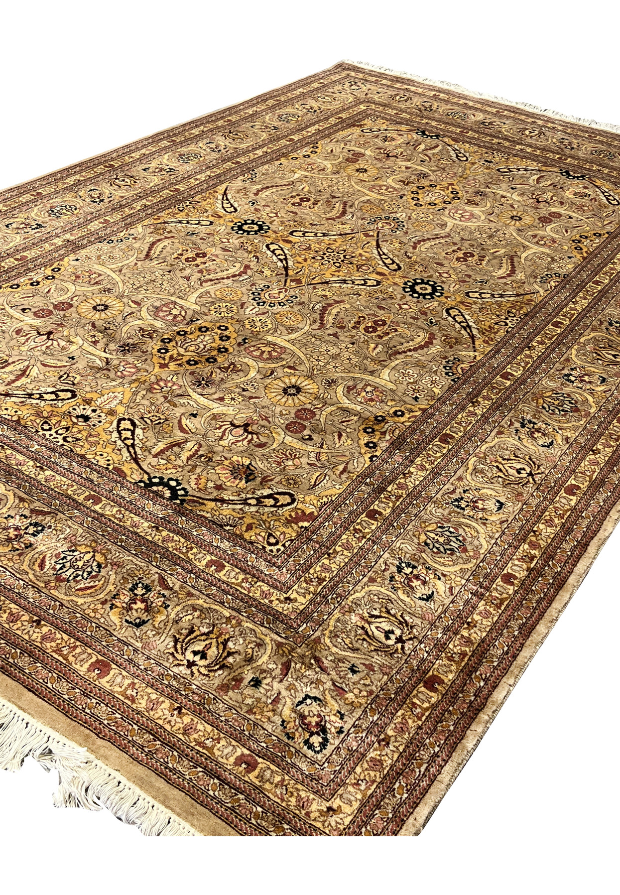 Angled view of wool Agra rug revealing pile texture, warm earth colors, and natural wear along edges