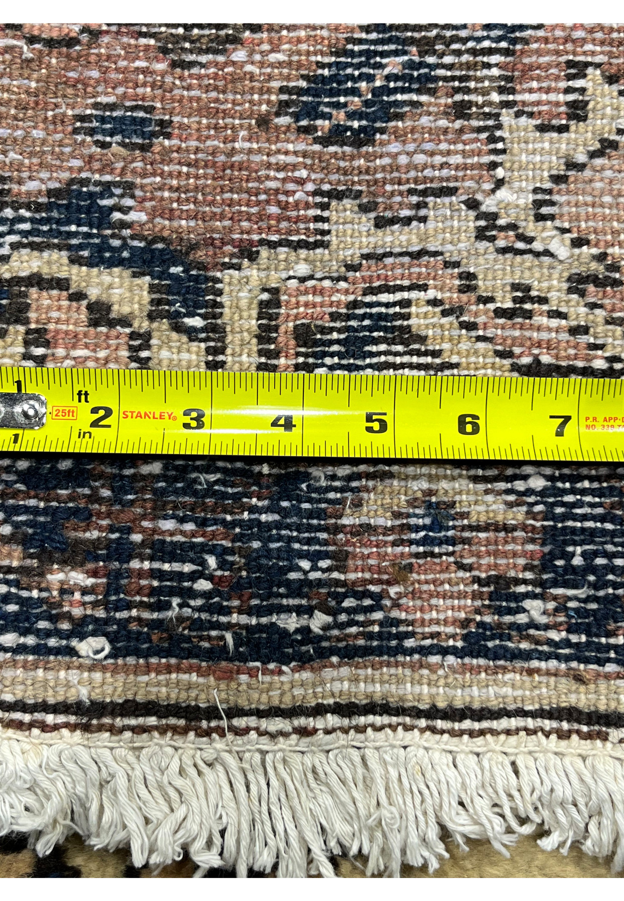 Backside with ruler of 11x13'3 Vintage Persian Heriz rug displaying knot density, hand knotted structure and authentic wool foundation