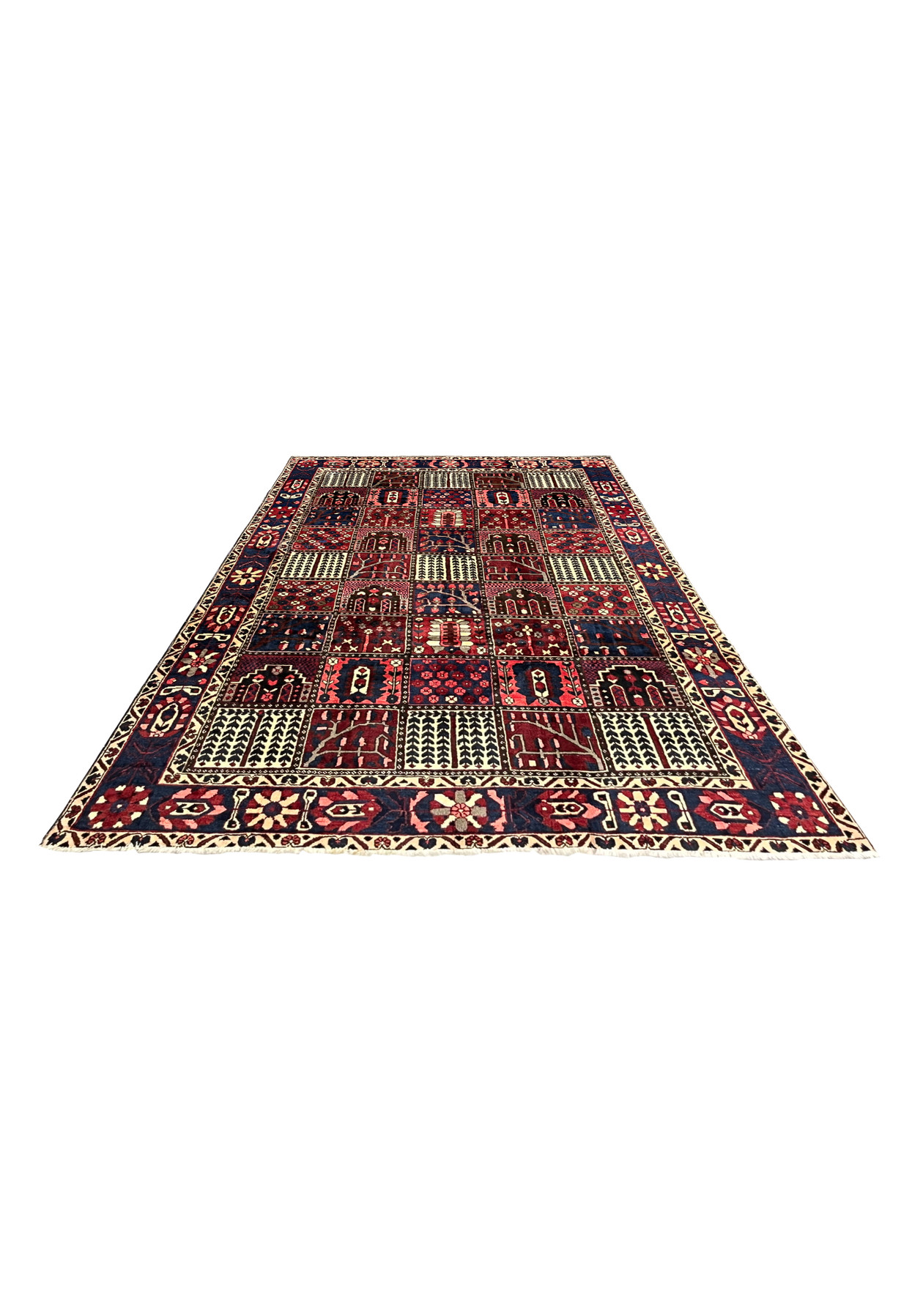 7x10 Persian Bakhtiari panel rug laid flat on floor, red navy ivory colors
