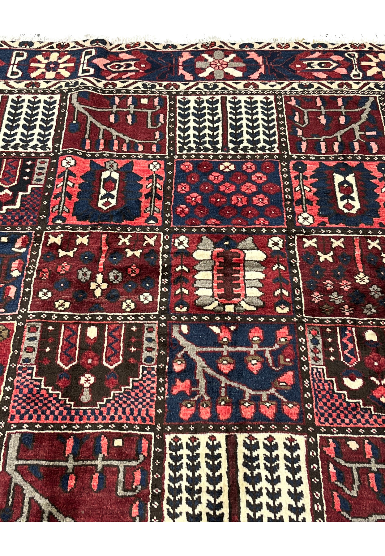 Zoomed panel detail showing weeping willow and flowering shrub compartments in 6'8x10 Bakhtiari rug