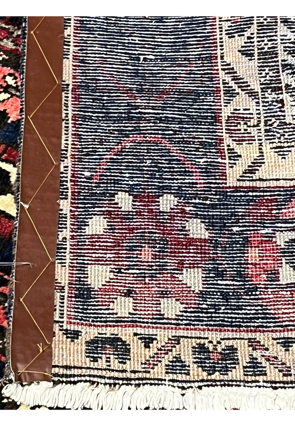 Back side of 7x10 Persian Bakhtiari panel rug showing hand-knotted wool construction