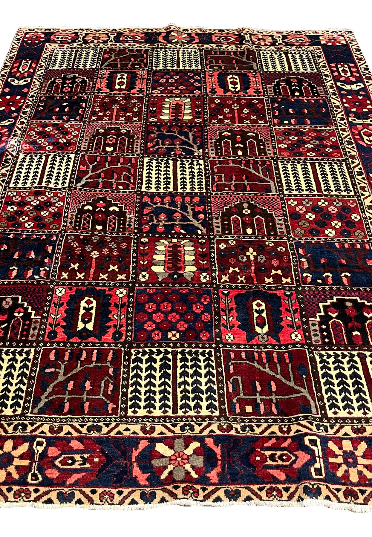 Center field view of 7x10 Persian Bakhtiari rug with garden panel motifs in red and navy