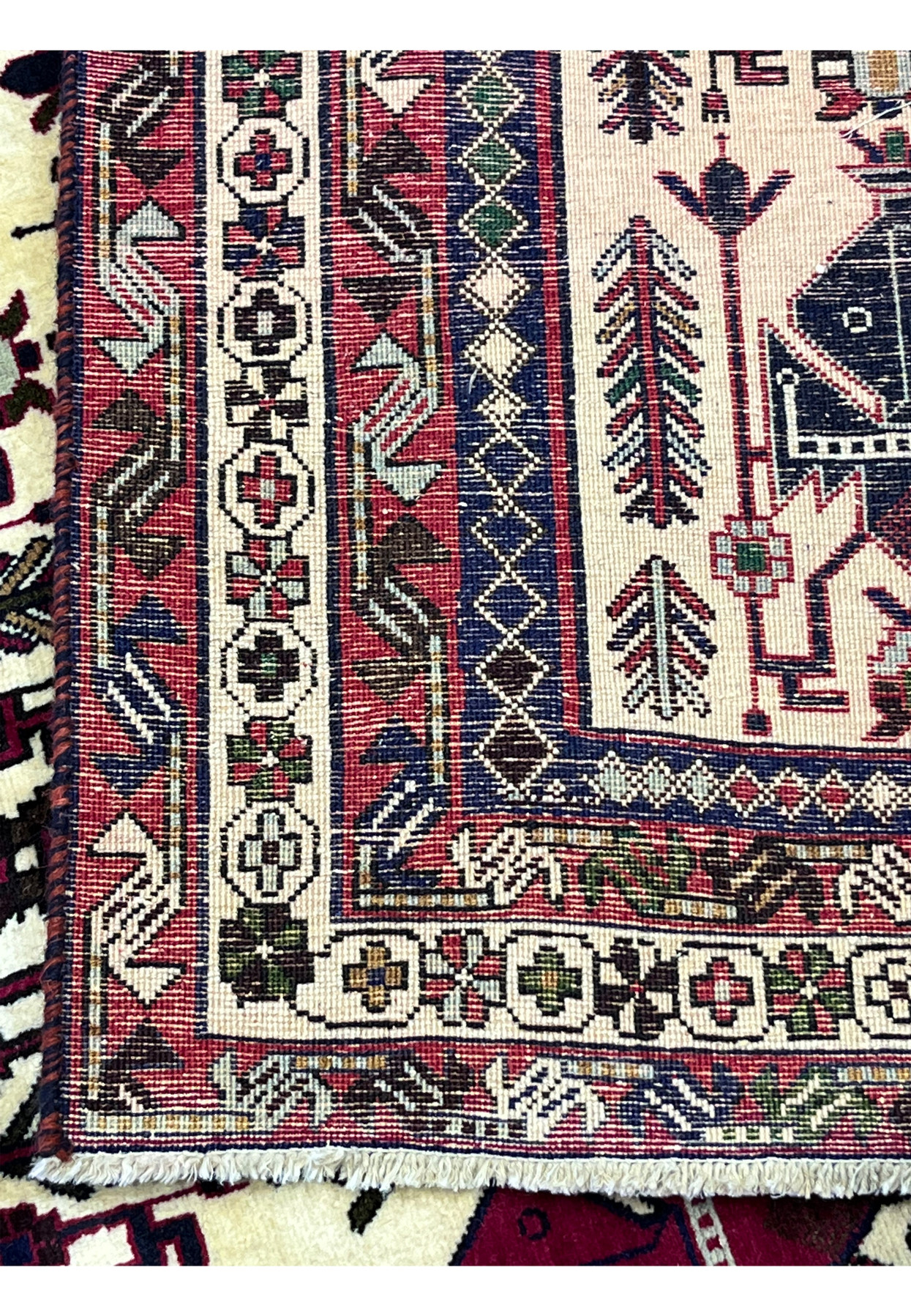 Back of 5x8 Persian Afshar tribal rug showing hand-knotted wool construction and knot density
