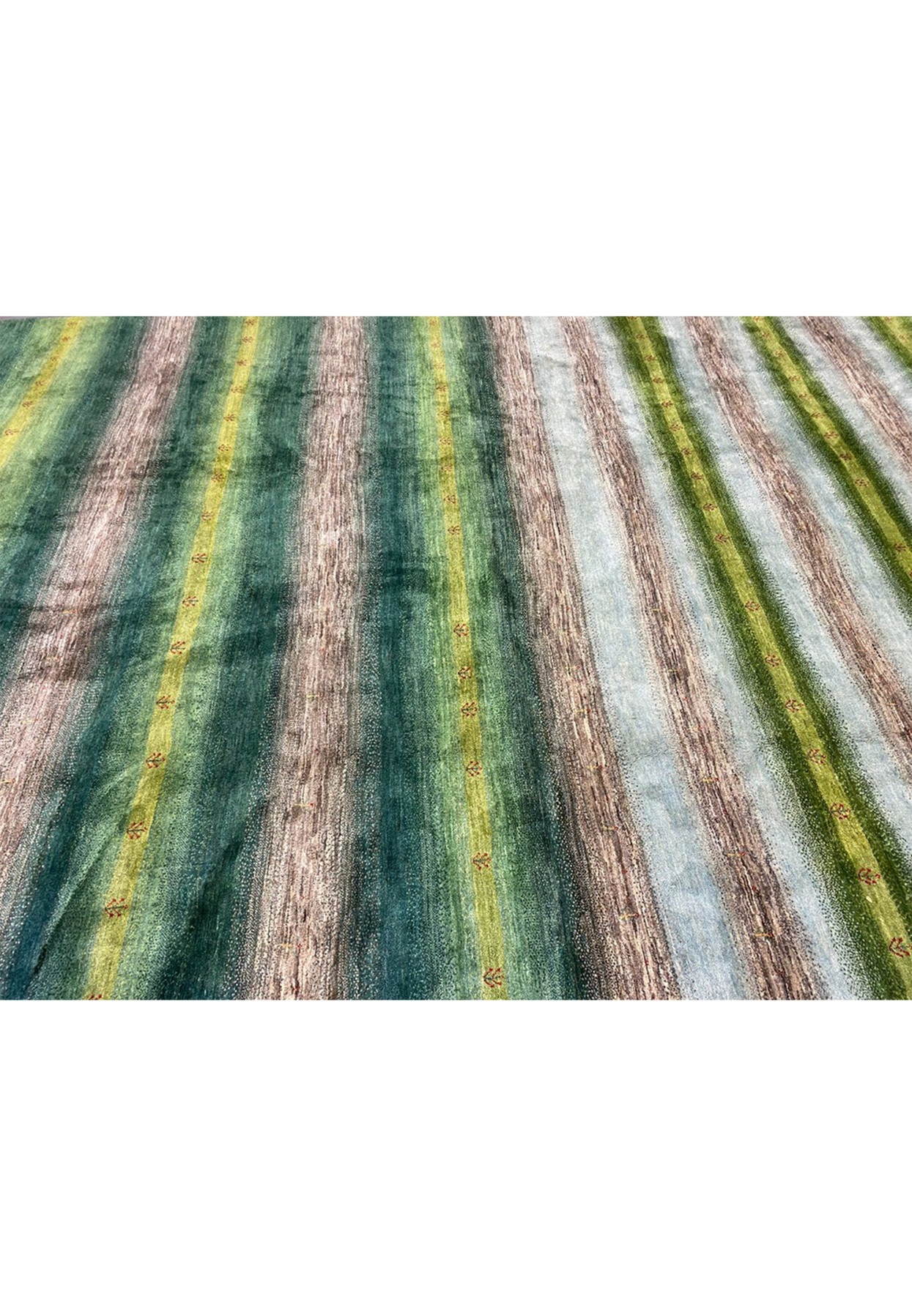 Striped green Indo Gabbeh surface revealing dense wool pile and sturdy cotton foundation construction