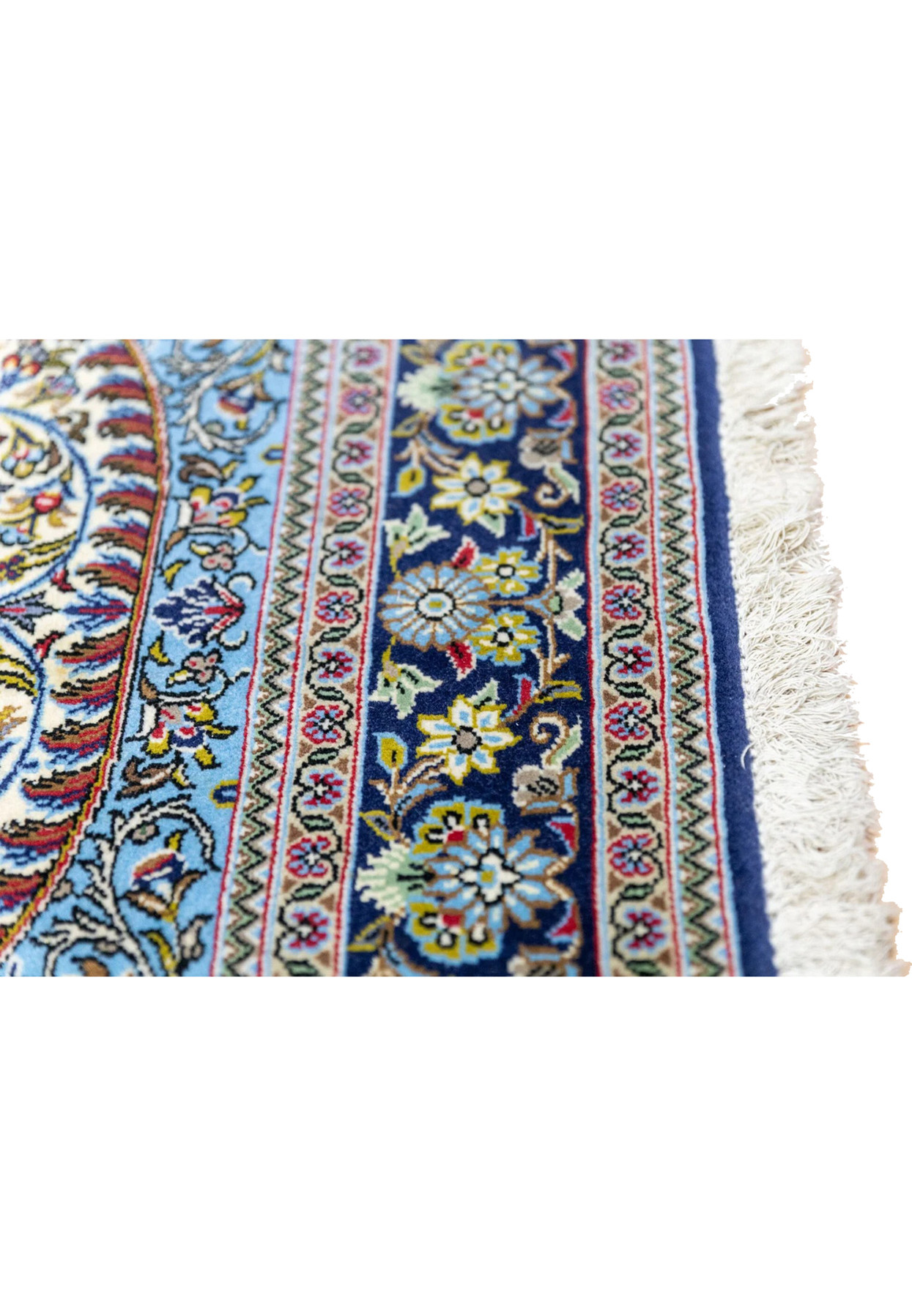 Lower indigo border with sixteen lotus rosettes alternating sky blue and ivory on Persian Qum rug