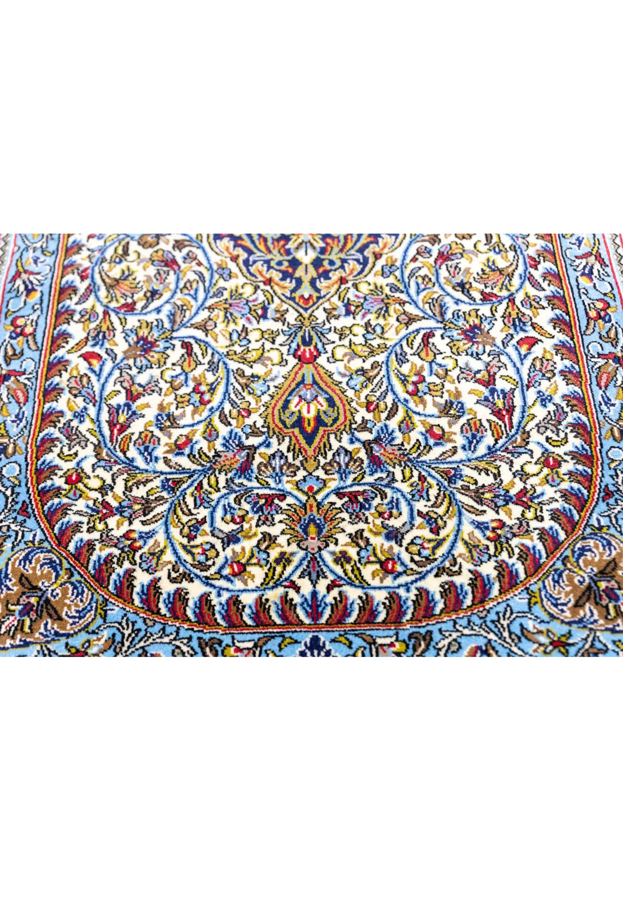 Lower field of Persian Qum kork rug showing curling islimi vines and pendant medallion in cream cartouche