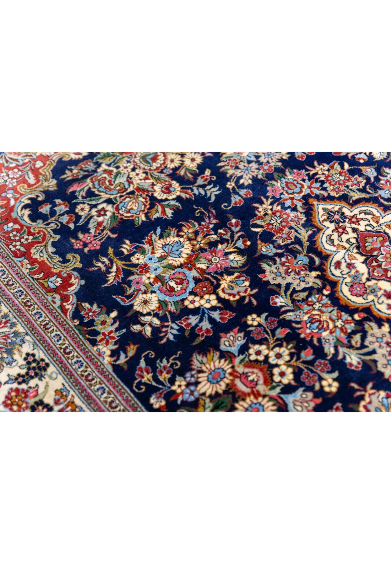 Pattern and motif close-up of Persian Qum kork rug showing peony rose and daisy bouquets in master detail