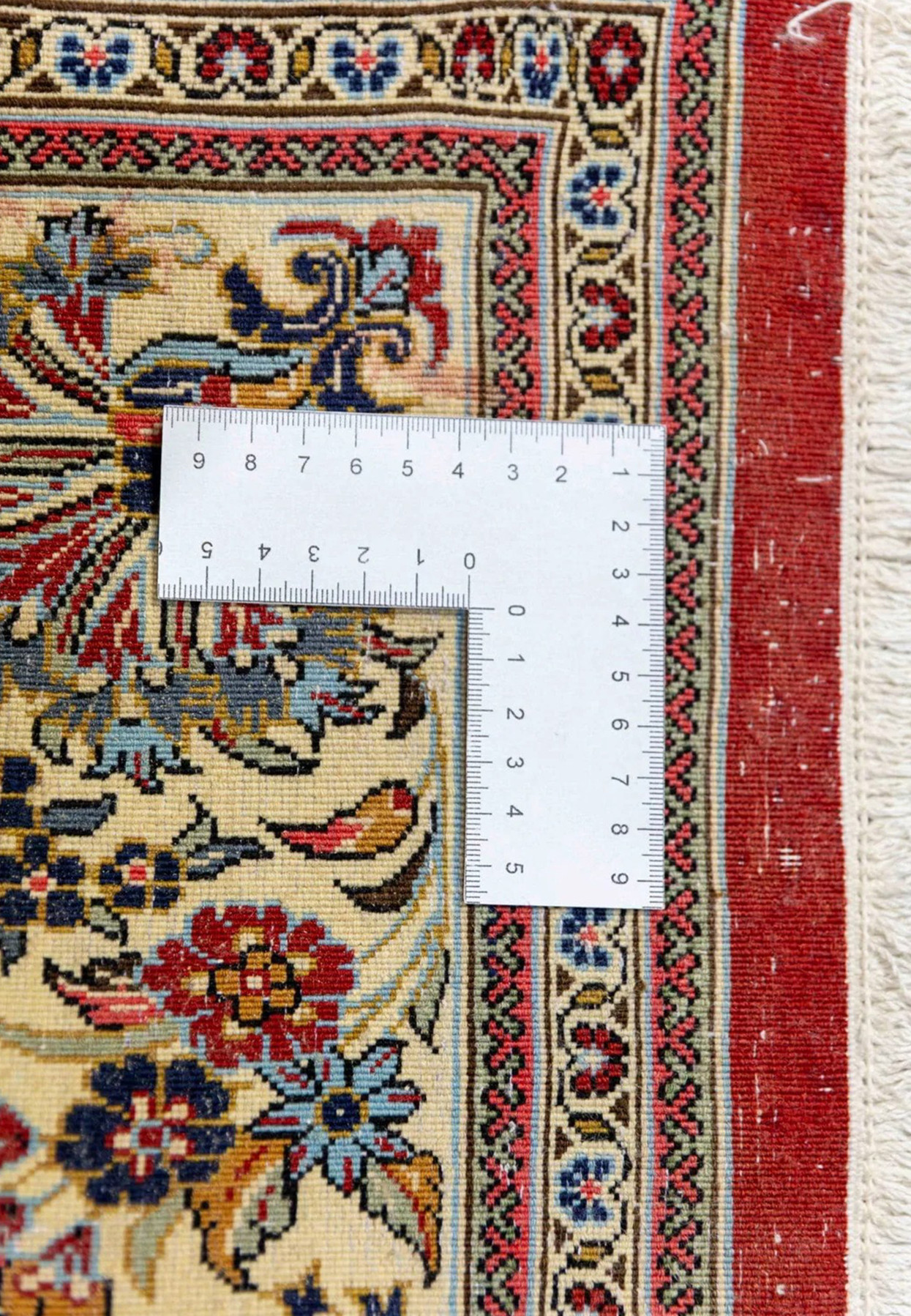 Backside of Persian Qum rug measured at 400 KPSI showing 640000 knots per square meter weave density