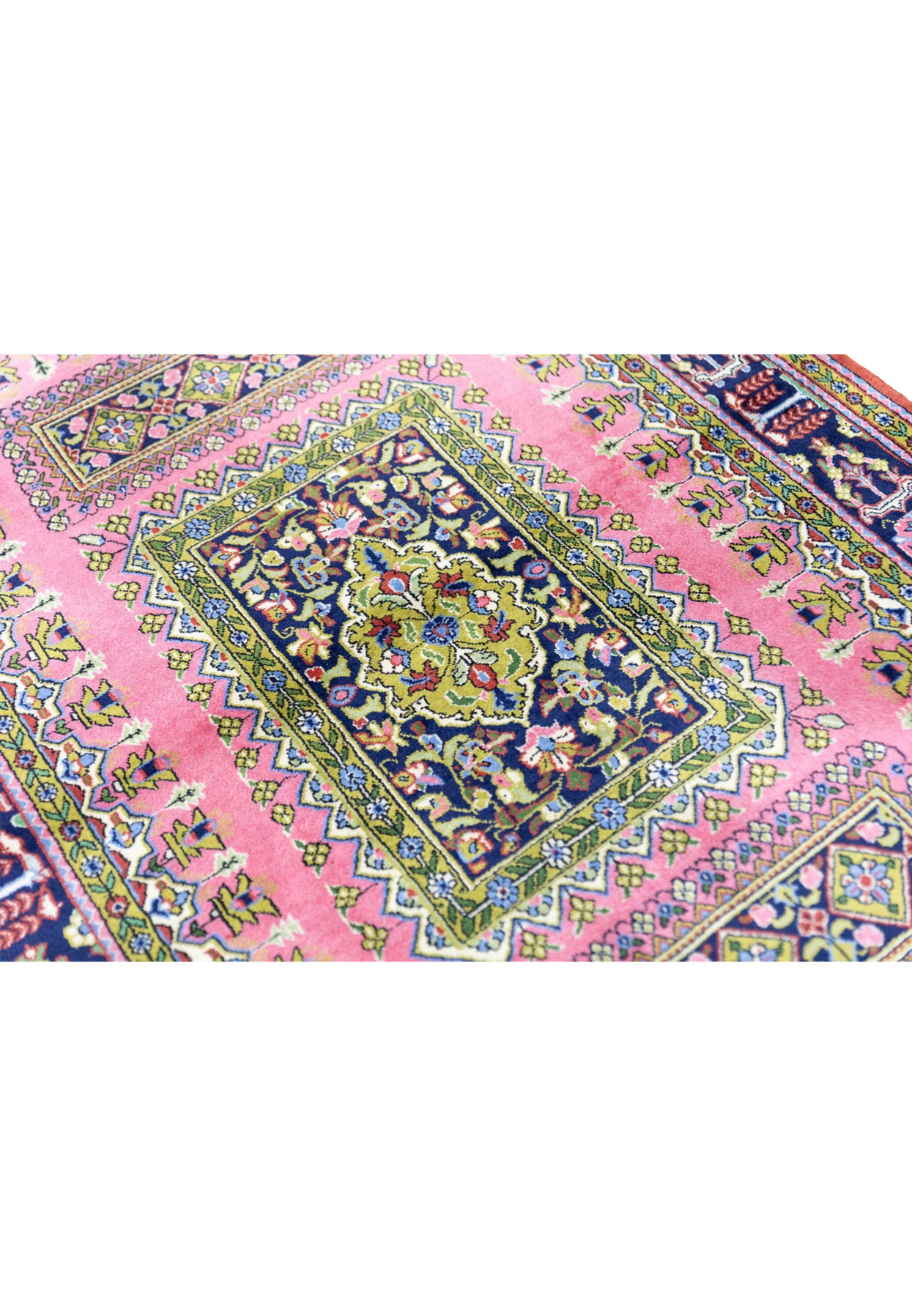 Central cartouche close-up of vintage Persian Qum rug with lime green medallion on midnight navy ground