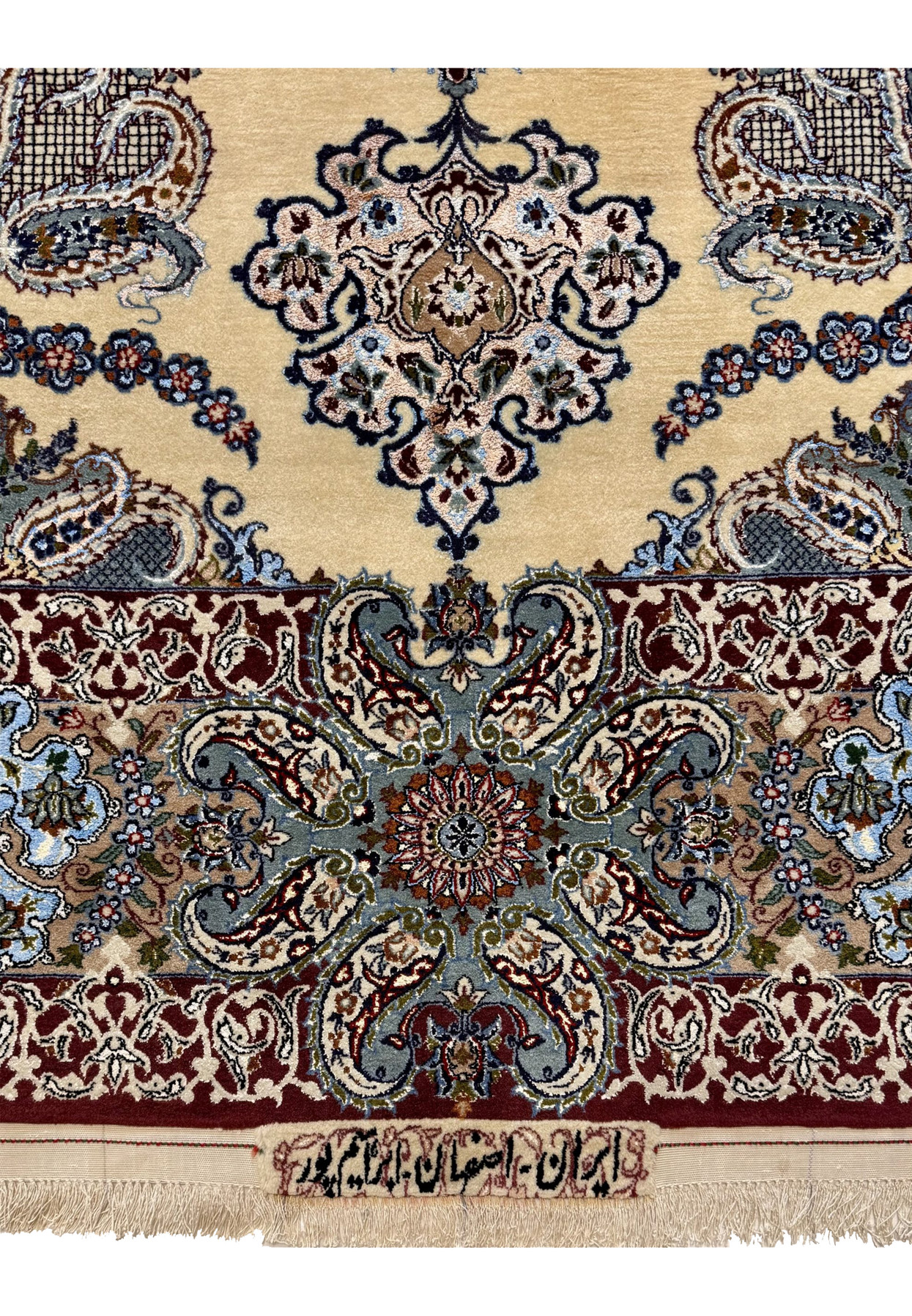 Persian script signature reading Iran Isfahan Ebrahimpour woven into the lower border of the rug