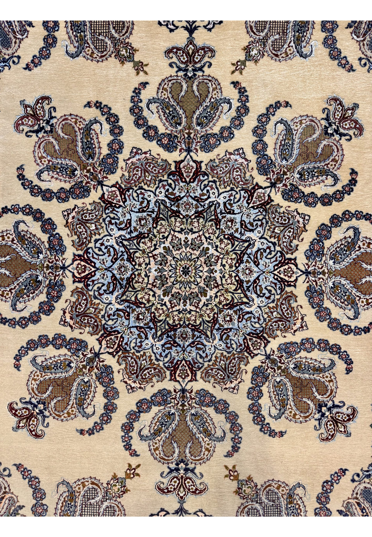 Snowflake-form central medallion in soft sky blue framed by curved paisley wreaths on ivory ground