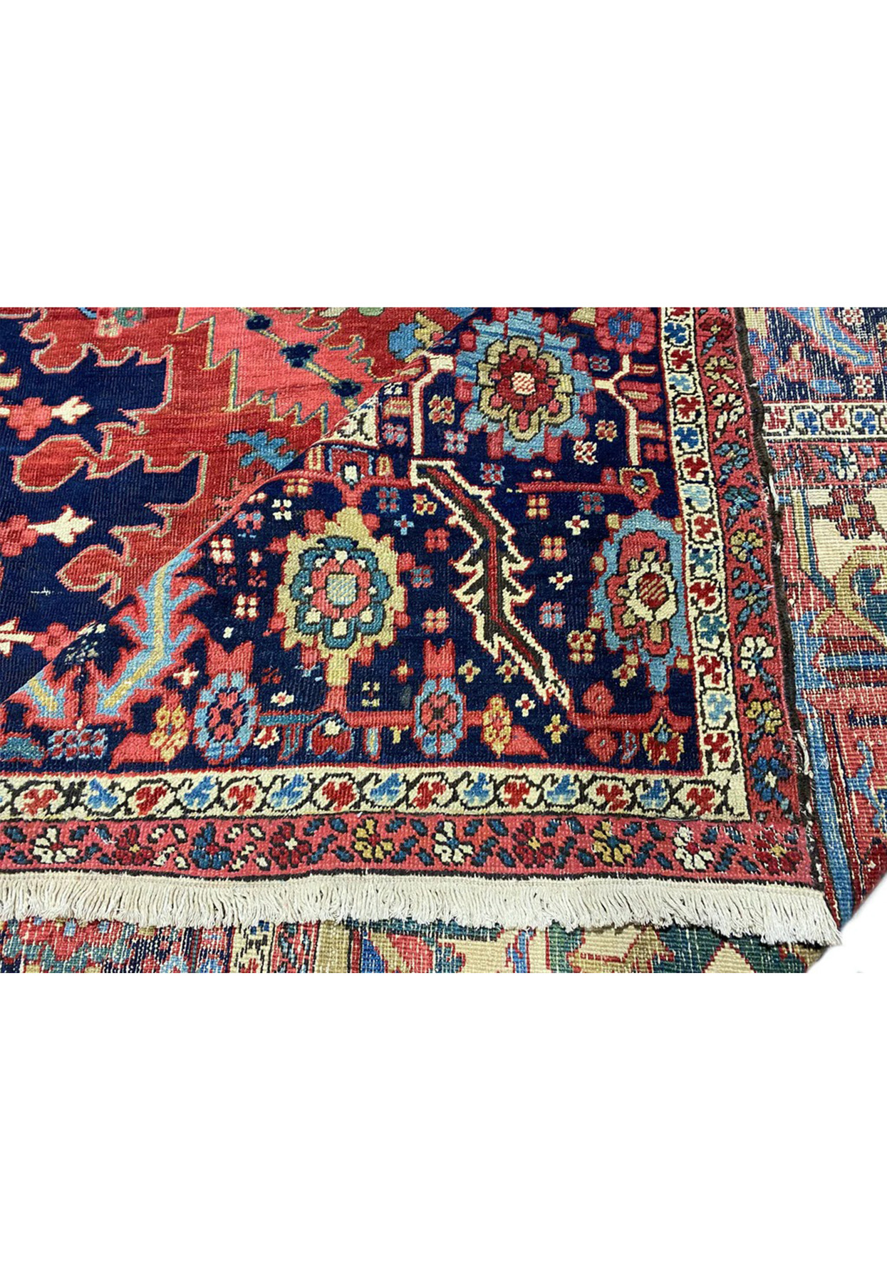 Midnight navy main border of antique Heriz rug with palmette and turning vine repeat motifs