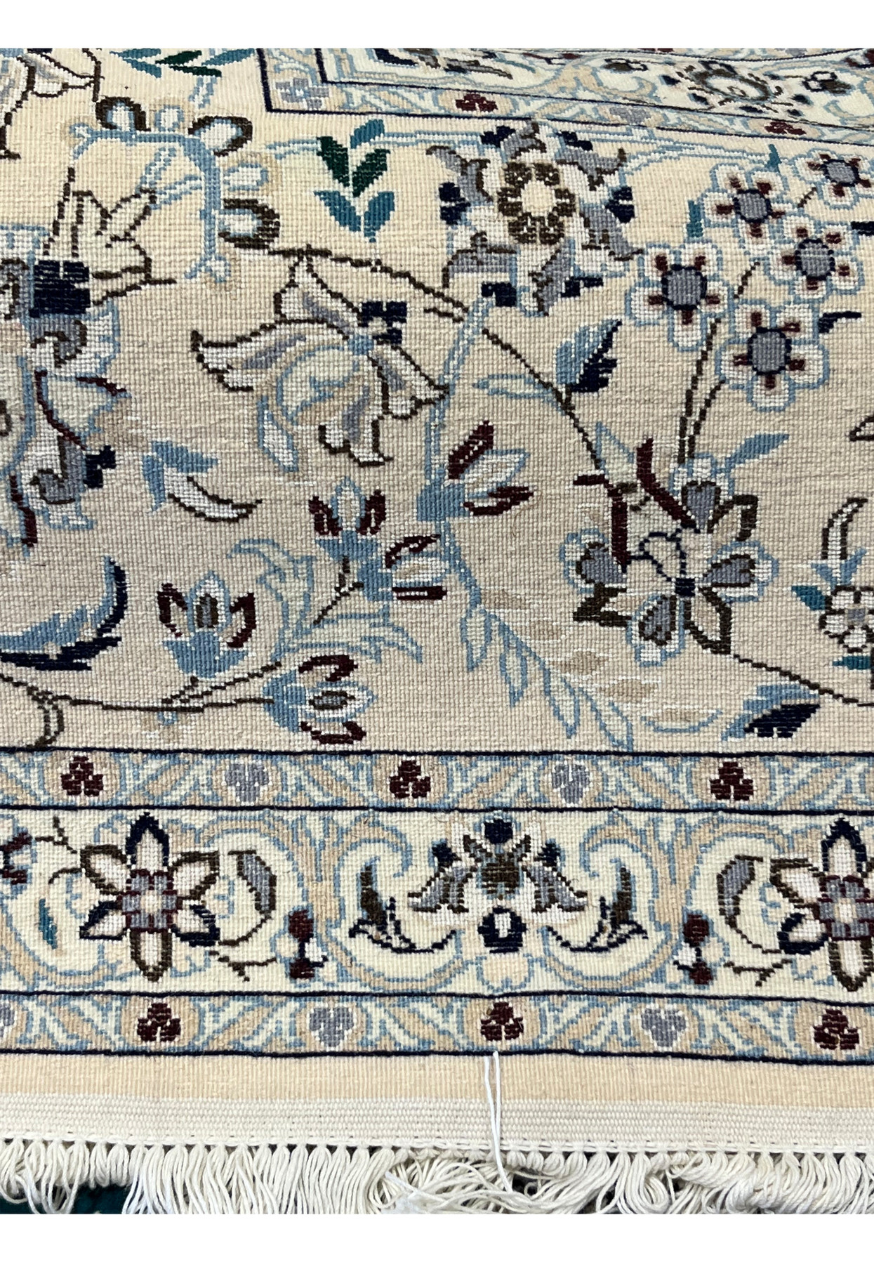 Backside closeup of Habibian Nain wool and silk rug showing tight even knotting on silk warp