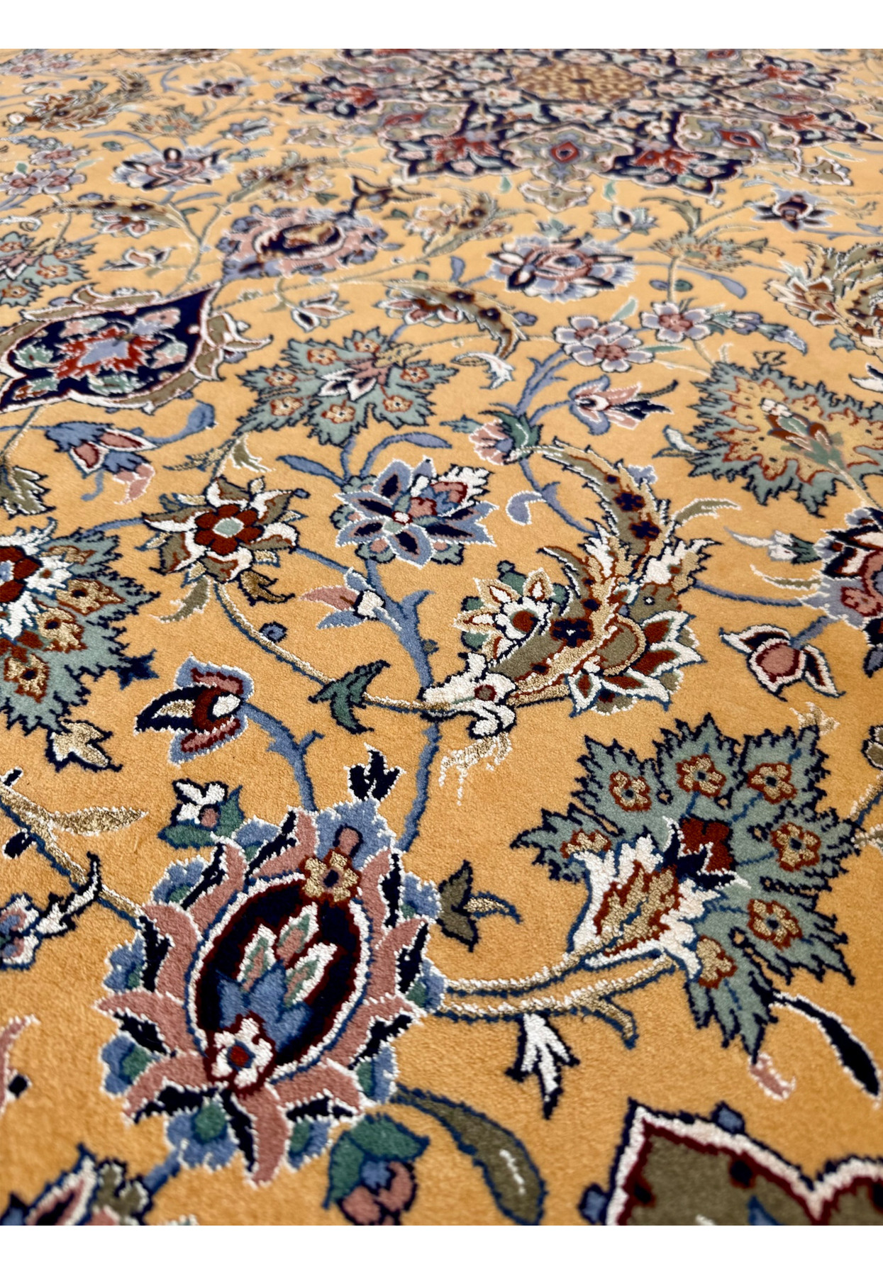 Pattern detail of saffron field showing Isfahan palmettes, lotus blossoms, and pure silk floral highlights