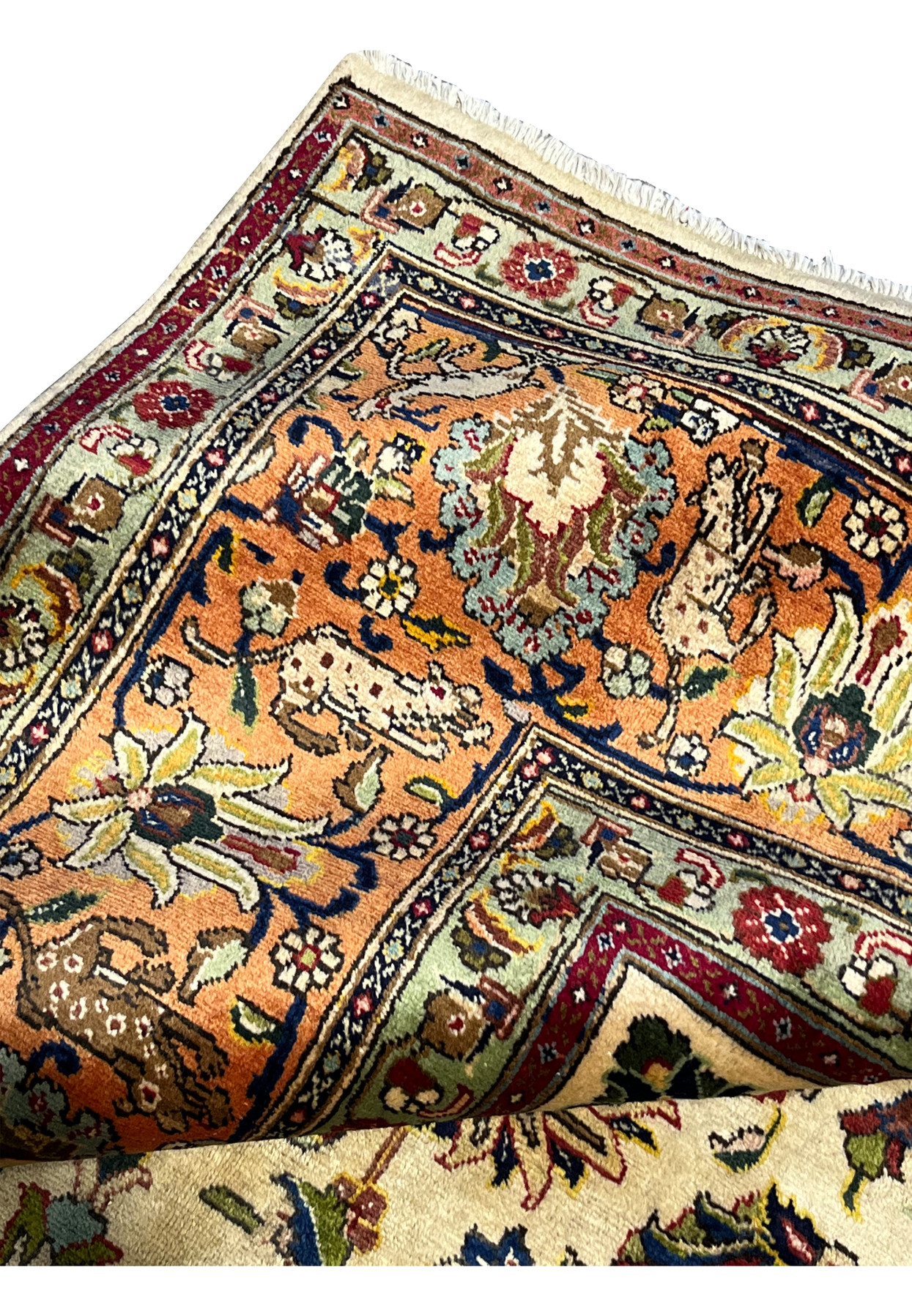 Backside fold showing the clean reverse and the high knot count typical of fine Tabriz workshop weaving