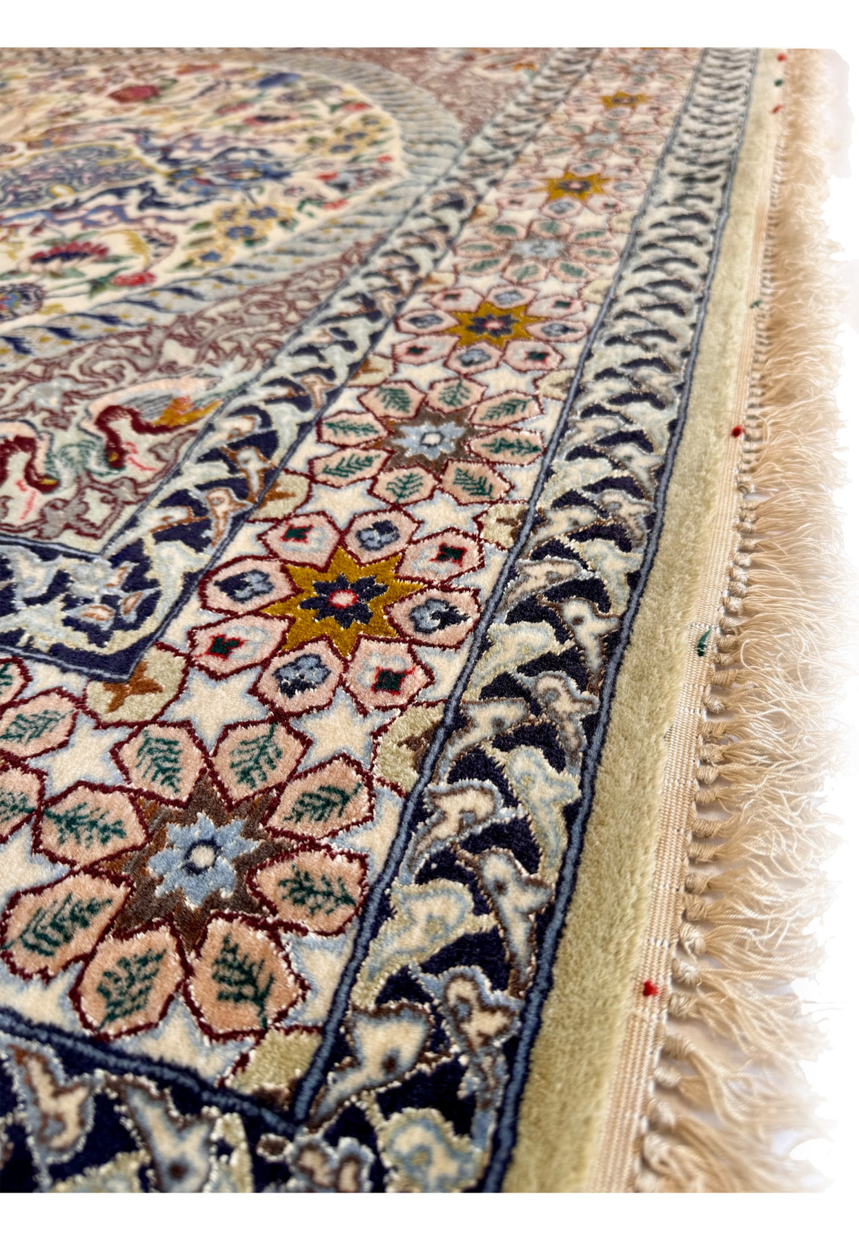 Top-down full view of the Persian Isfahan showing the ivory field composition with mihrab arch, central medallion, and vase of flowers below