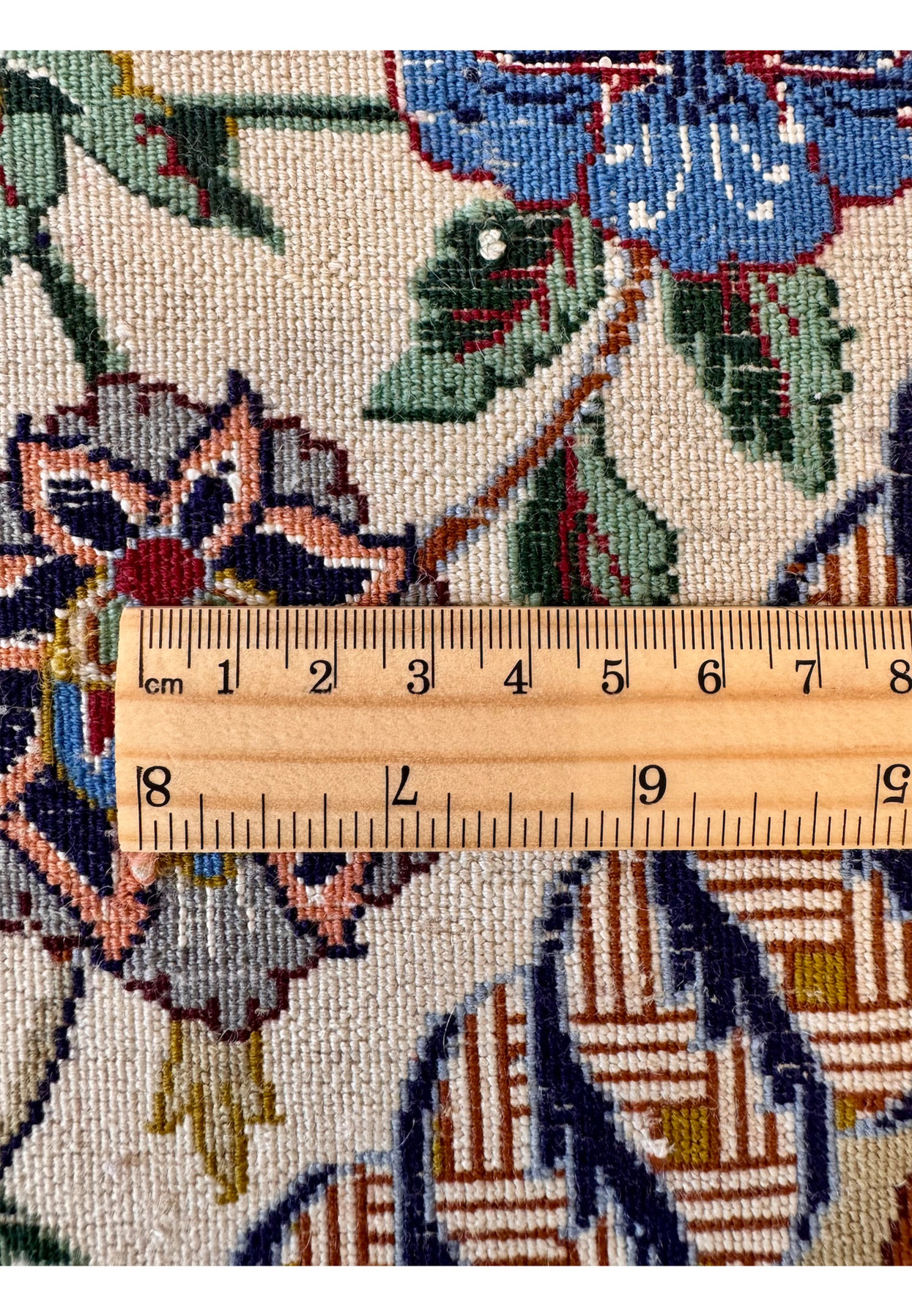 Tape measure across the back documenting the fine knot density that places this vintage Isfahan in the master workshop quality range
