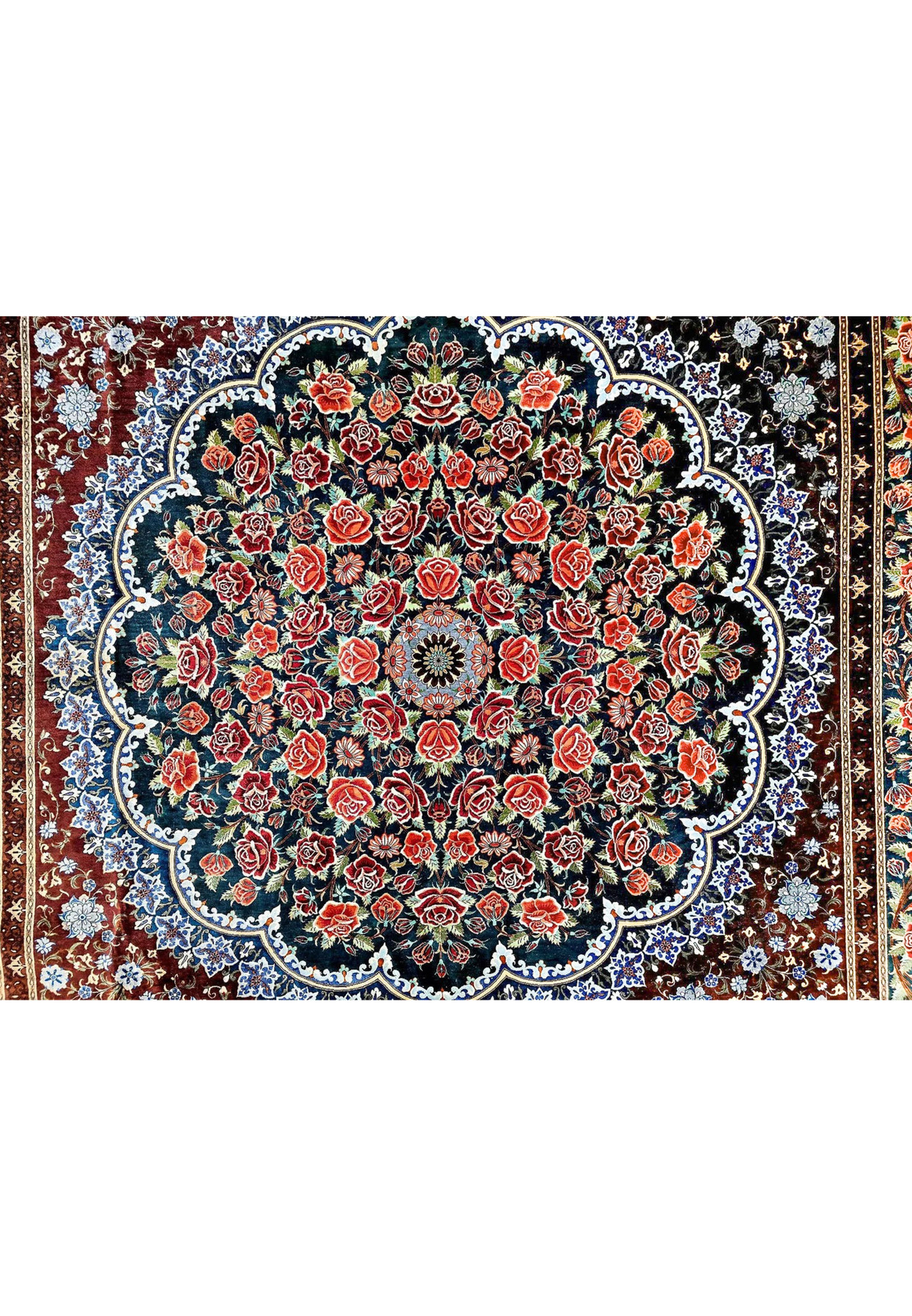 Central scalloped medallion of Persian Qum silk on silk rug, dense rose garden on midnight blue field with lobed cusps