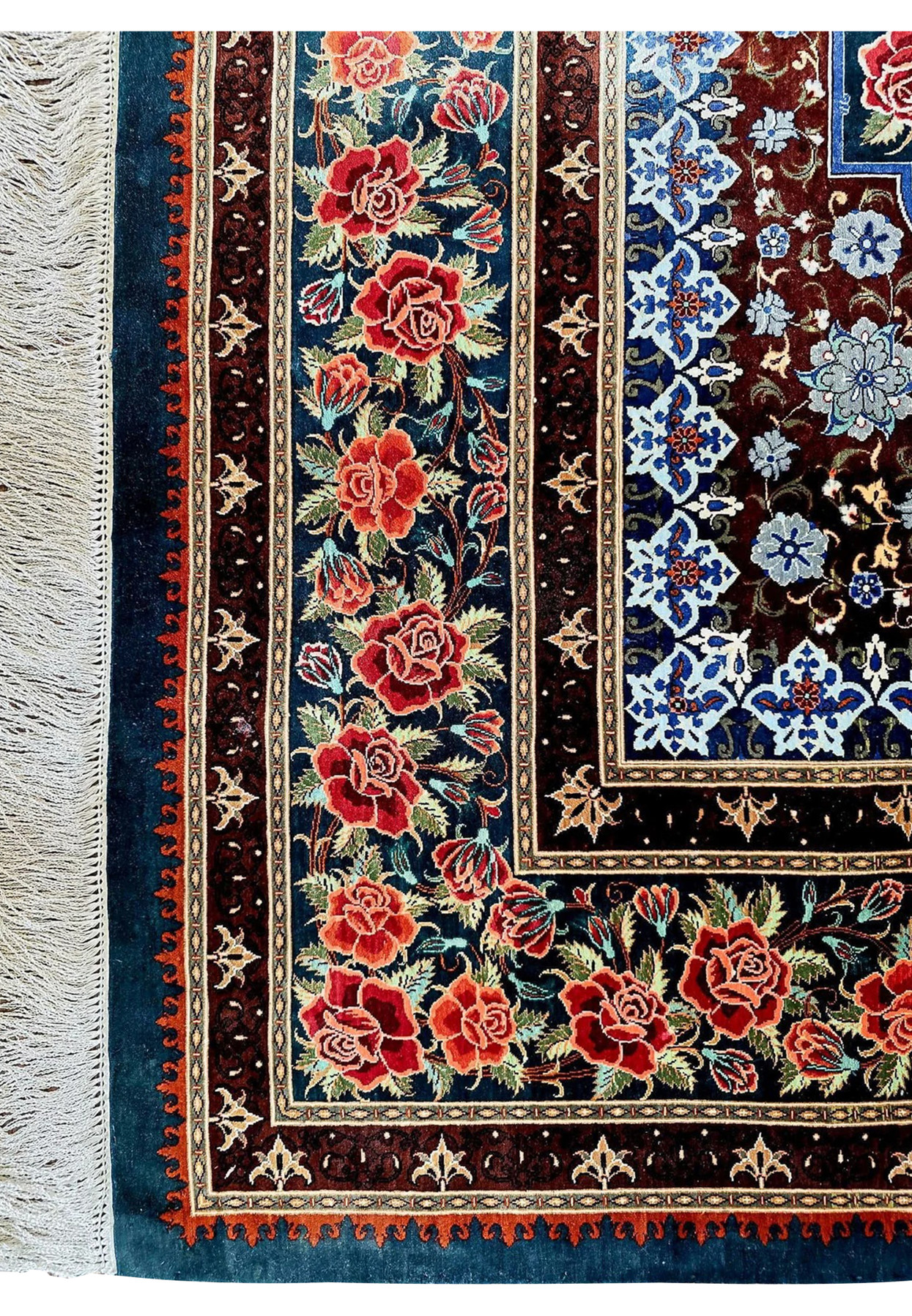 Corner detail with silk fringe and rose vine border on hand knotted Persian Qum silk on silk Mohseni signed rug