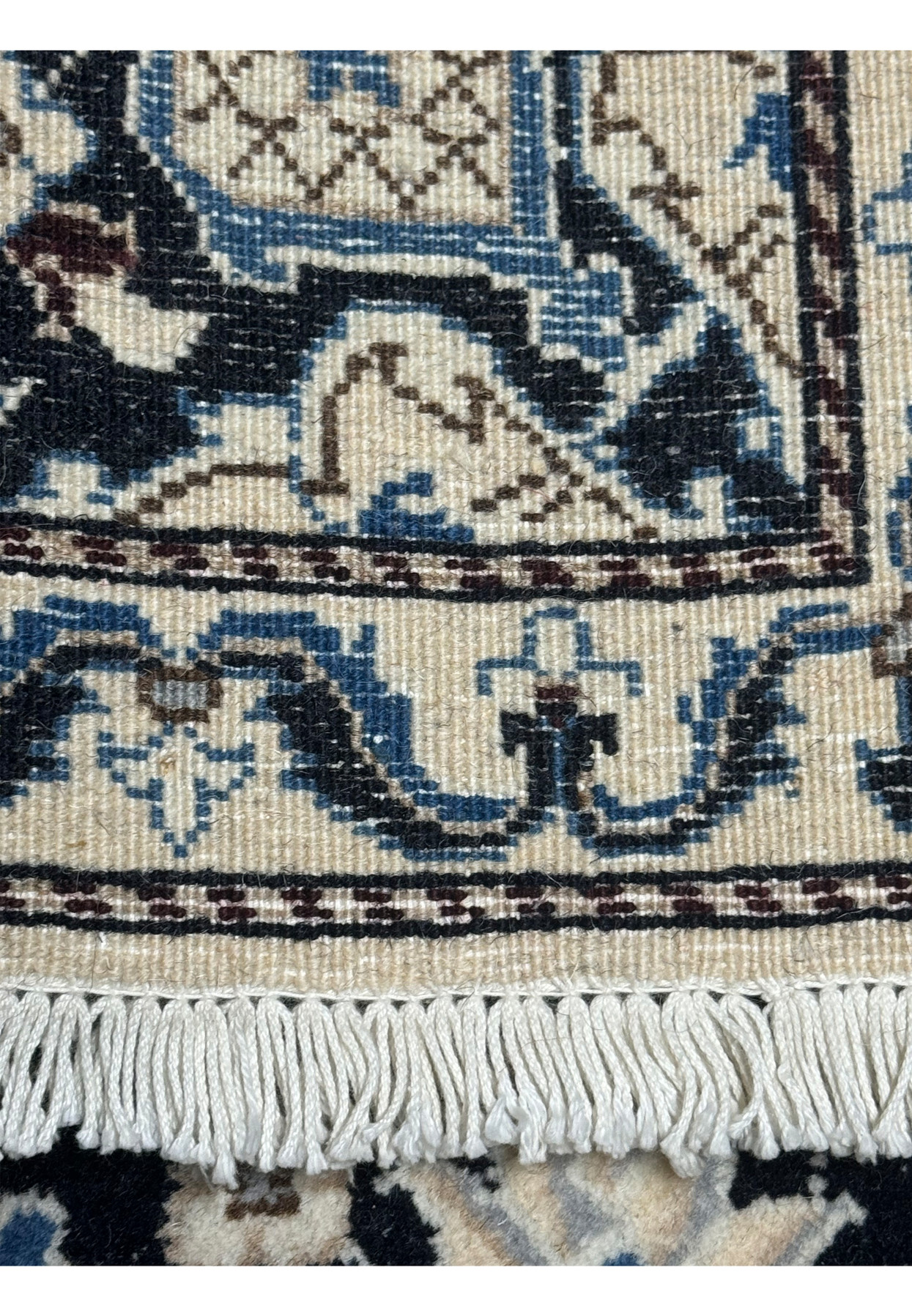 Backside knot density closeup of 3x5 Persian Nain rug showing approximately 180 to 220 KPSI on cotton foundation