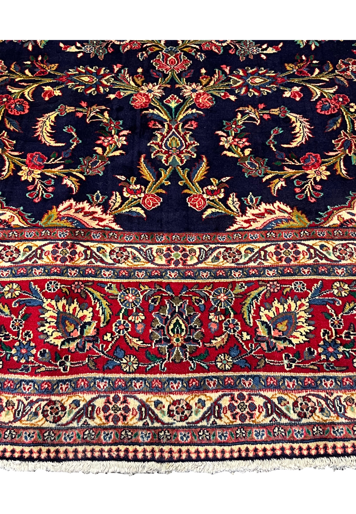 Lower spandrel detail of 10x13 Qum kork rug, ivory corner cartouche with dense palmette and curling vine on navy ground