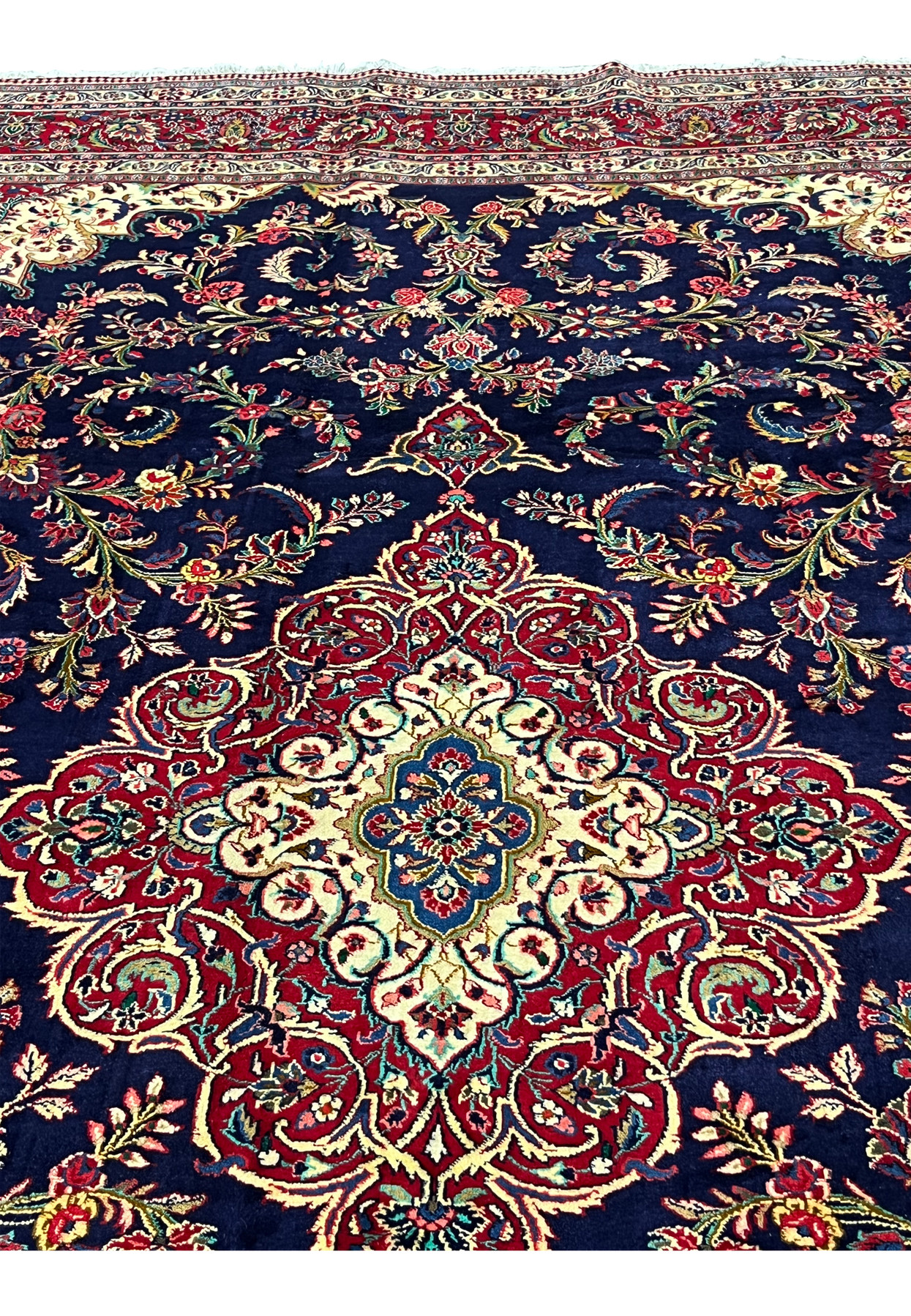 Field detail of 10x13 Persian Qum kork rug, free flowing rose bouquets and scrolling vines on saturated midnight navy