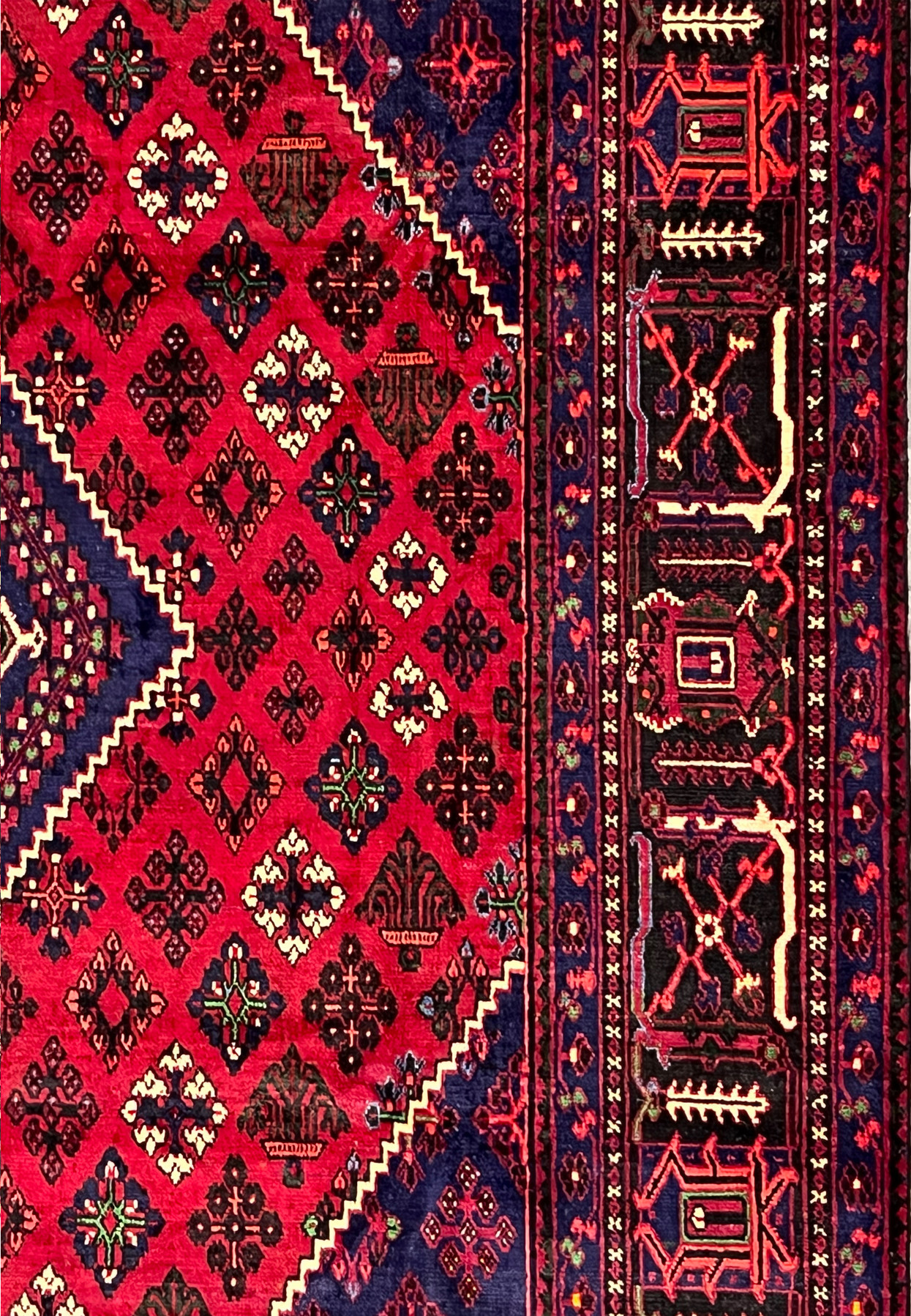 Side border detail of Persian Meymeh rug showing paired hooked cross panels on black ground, ivory X-cross guards