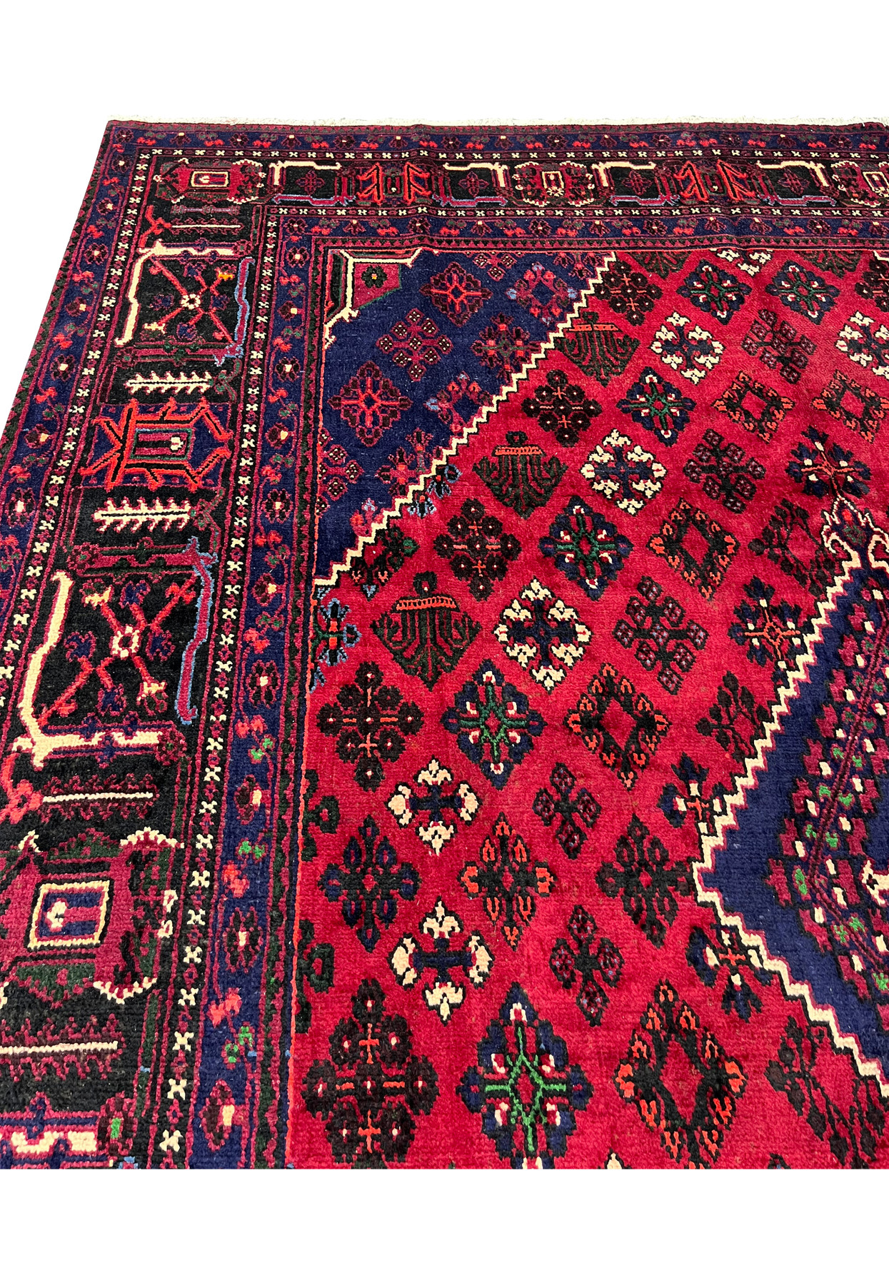 Close-up of Meymeh motifs, small geometric rosettes and vase forms inside diamond cells, cherry red field, handmade