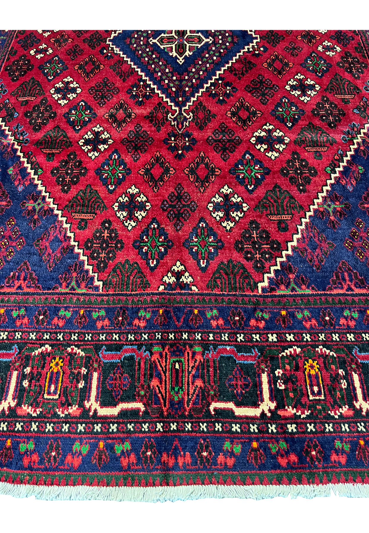 Lower border of 10x13 Persian Meymeh, navy guard with green and red floral sprigs, tribal main border, dining room rug
