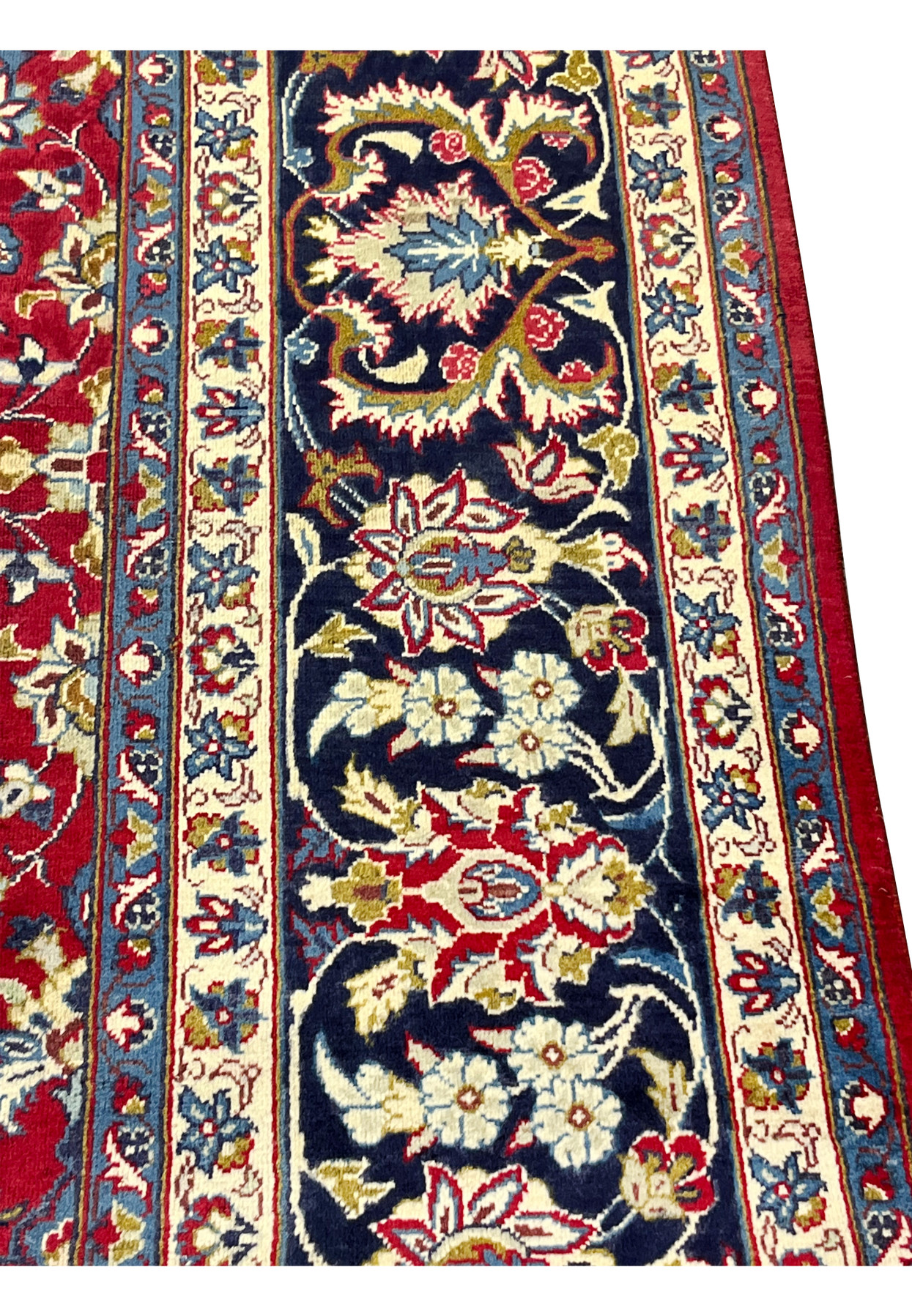 Close-up of navy border on Persian Najafabad, large ivory palmettes, gold leaves, red blossoms, fine workshop drawing