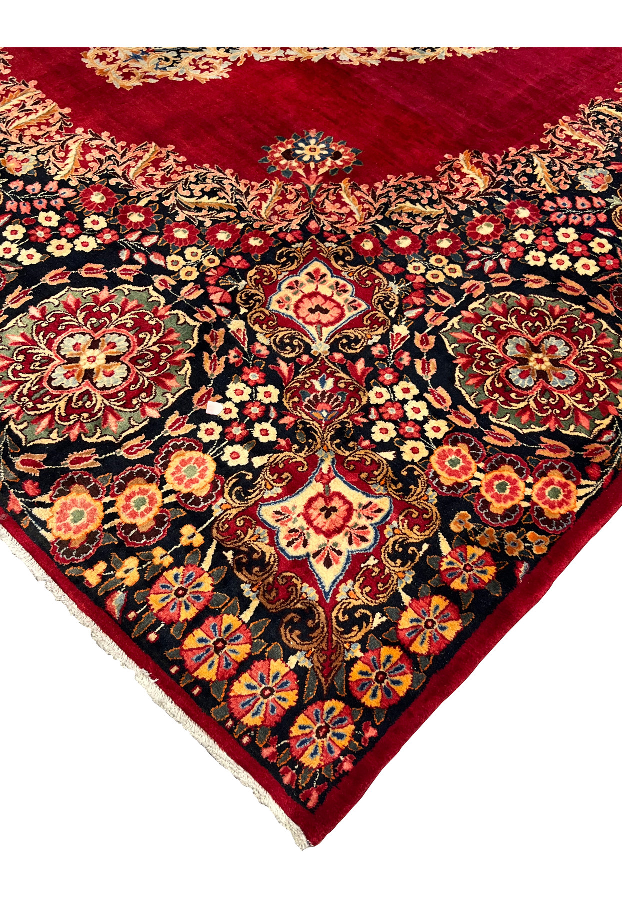 Edge of antique signed Moud rug, deep navy main border with large floral cartouches, hand-knotted wool on cotton