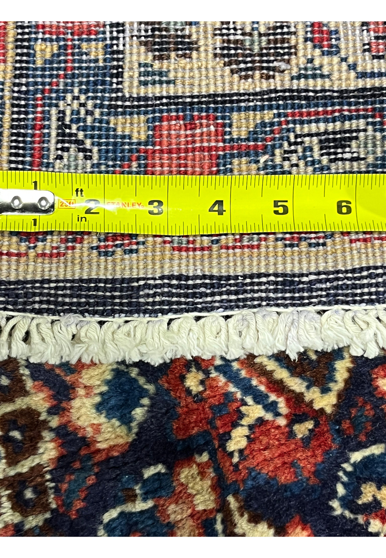 Knot density measured on back of Persian Mahal rug, ruler against weave showing approximately 220 to 240 KPSI