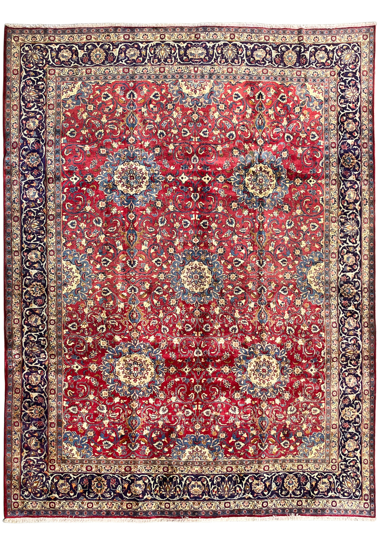 9x12 Persian Isfahan rug full view, deep red field with ivory rosette discs and navy floral border, authentic handmade