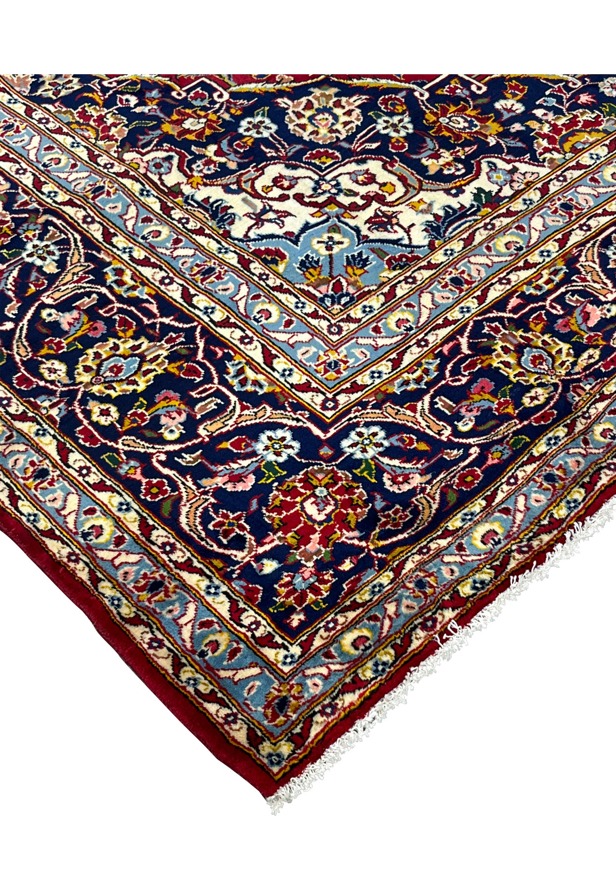 Corner edge of 10x15 Persian Kashan rug, navy spandrel and crisp guard borders on red field, never used handmade wool