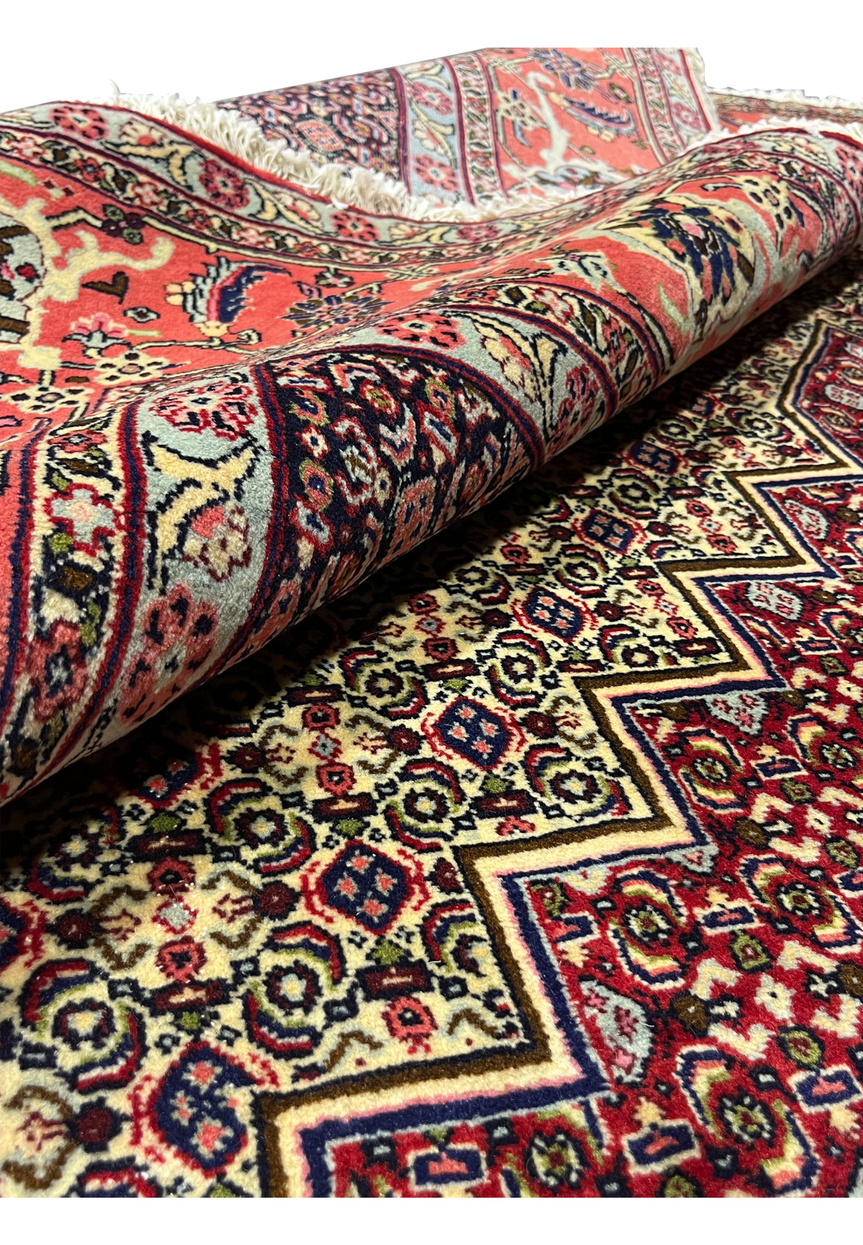 Rolled view Persian Senneh rug showing pile depth and back, 320 to 360 KPSI hand-knotted wool on cotton, never used Kurdish
