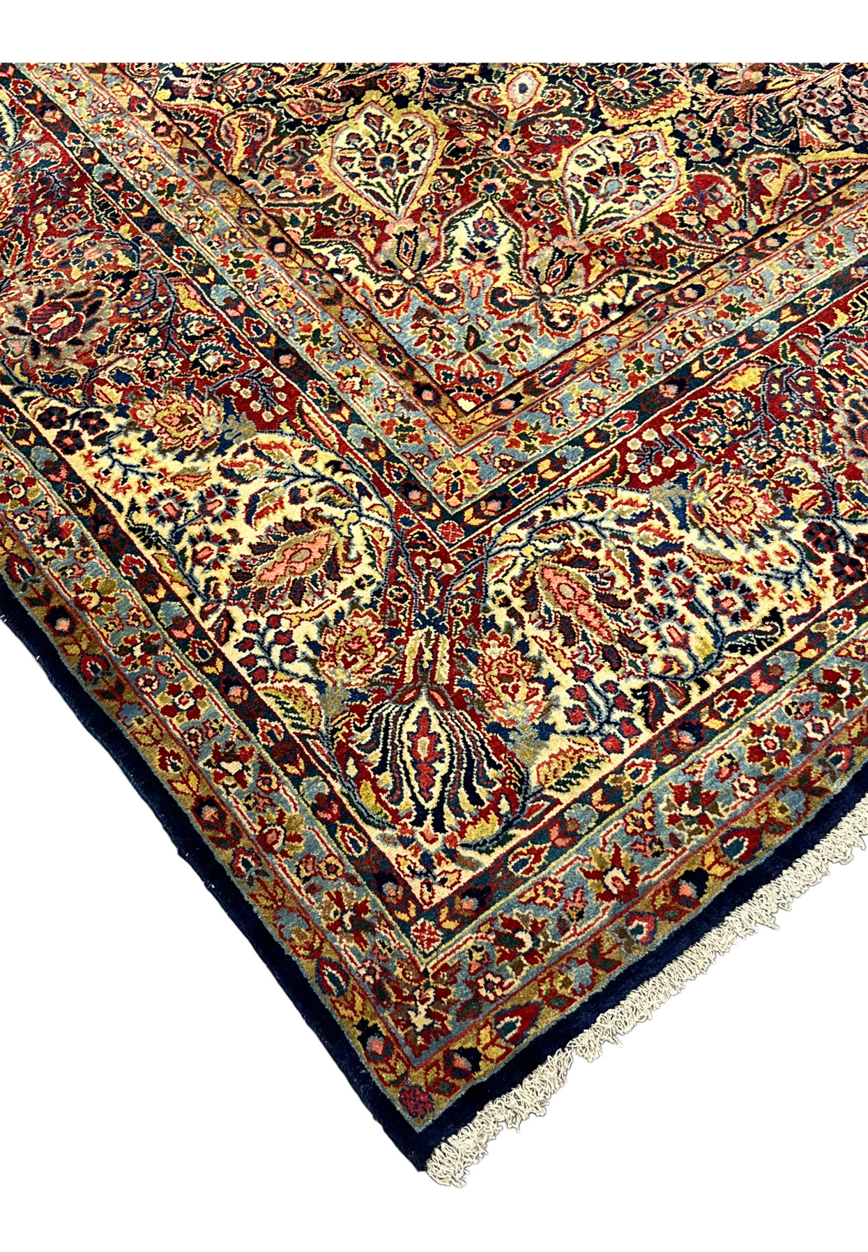 Antique Sarough rug border and corner spandrel detail, paired floral sprays in cream, navy, and crimson