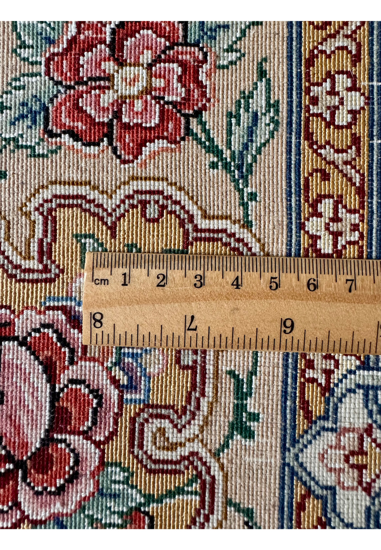 Backside knot measurement of Master Habib Isfahan rug, ruler confirming ultra fine 700 KPSI density