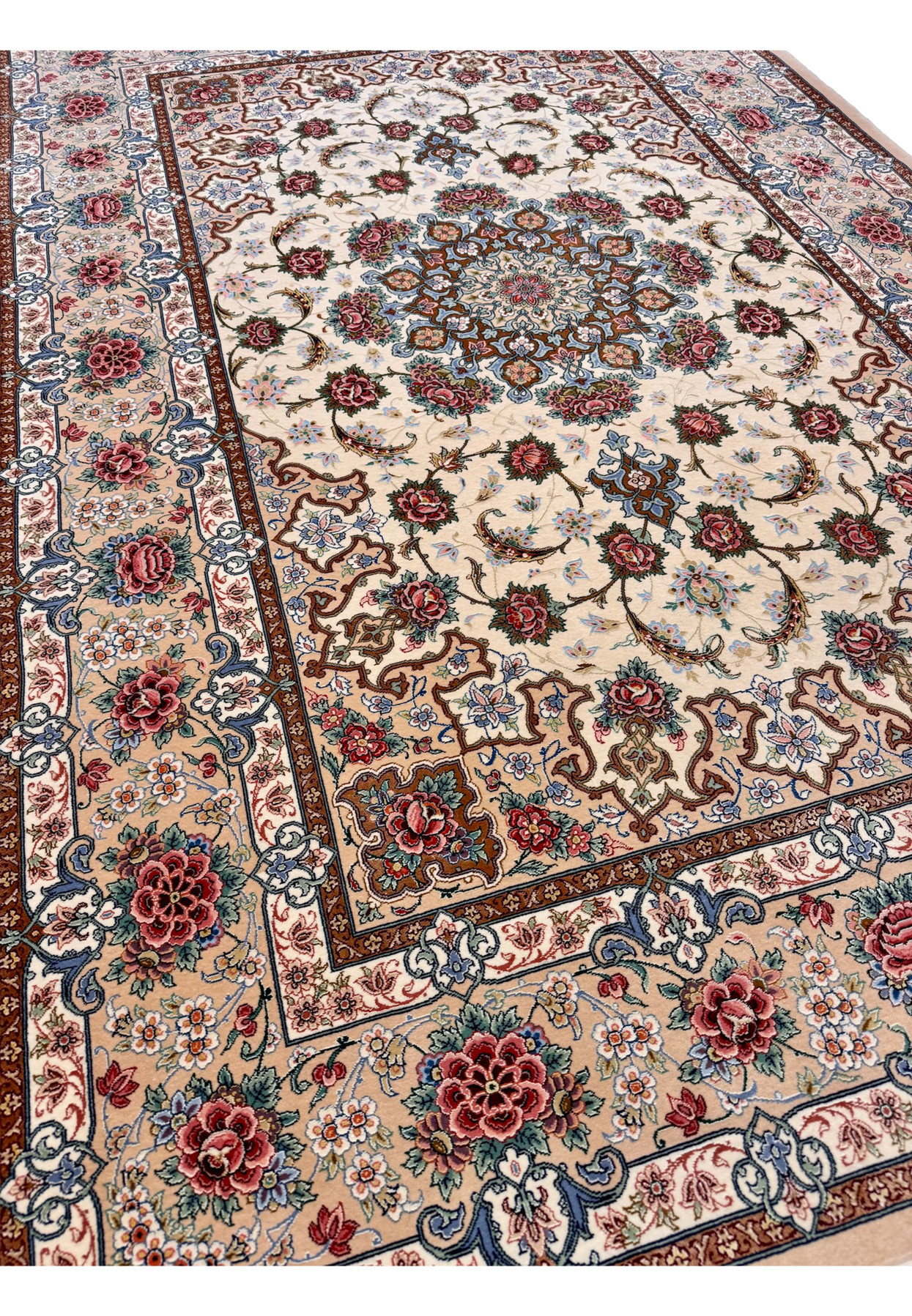Angled view of fine Persian Isfahan rug by Master Habib, kork wool and silk pile with raised silk highlights