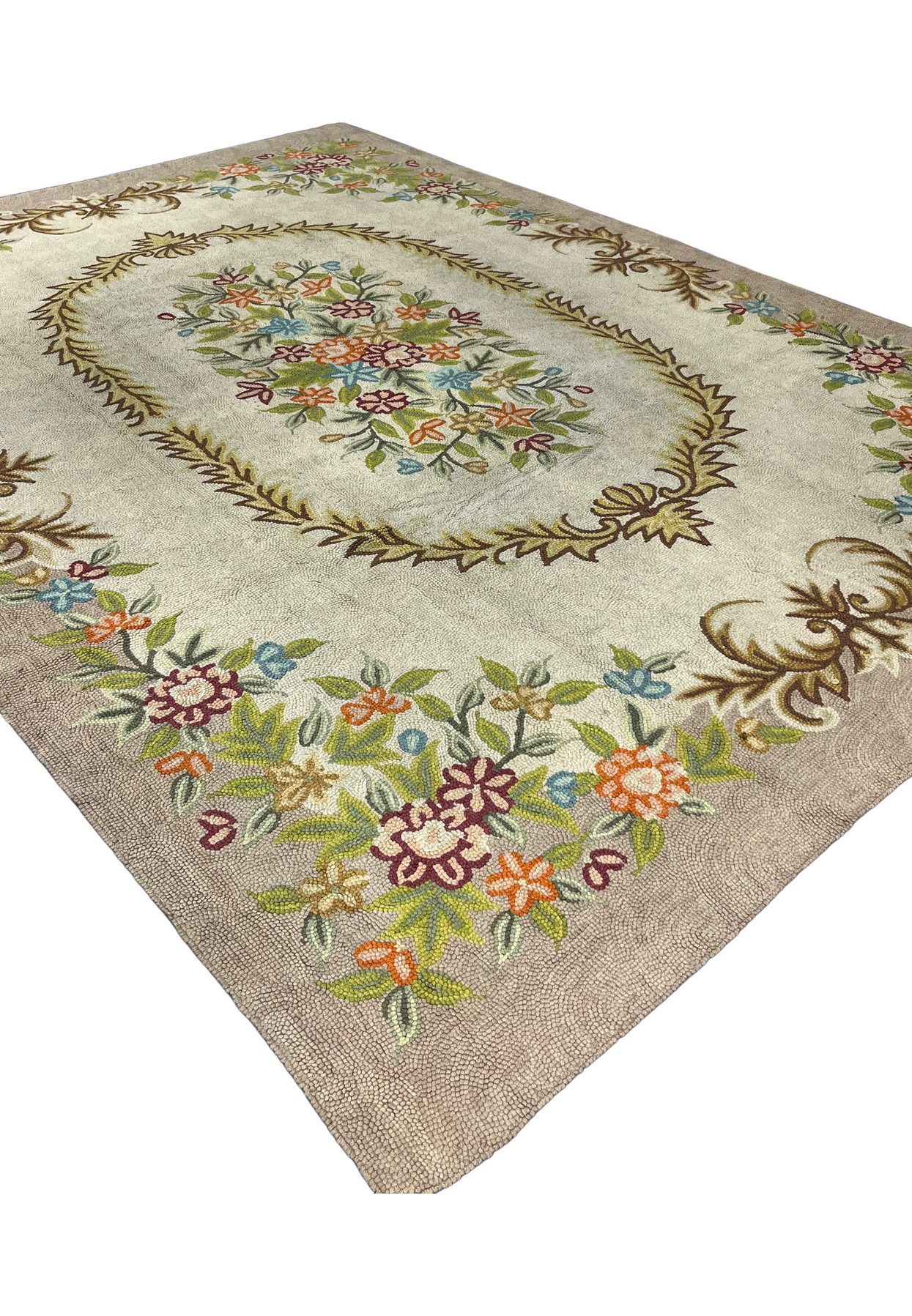 Angled view of hand-hooked floral rug showing cream center, taupe border, and brown acanthus scrollwork