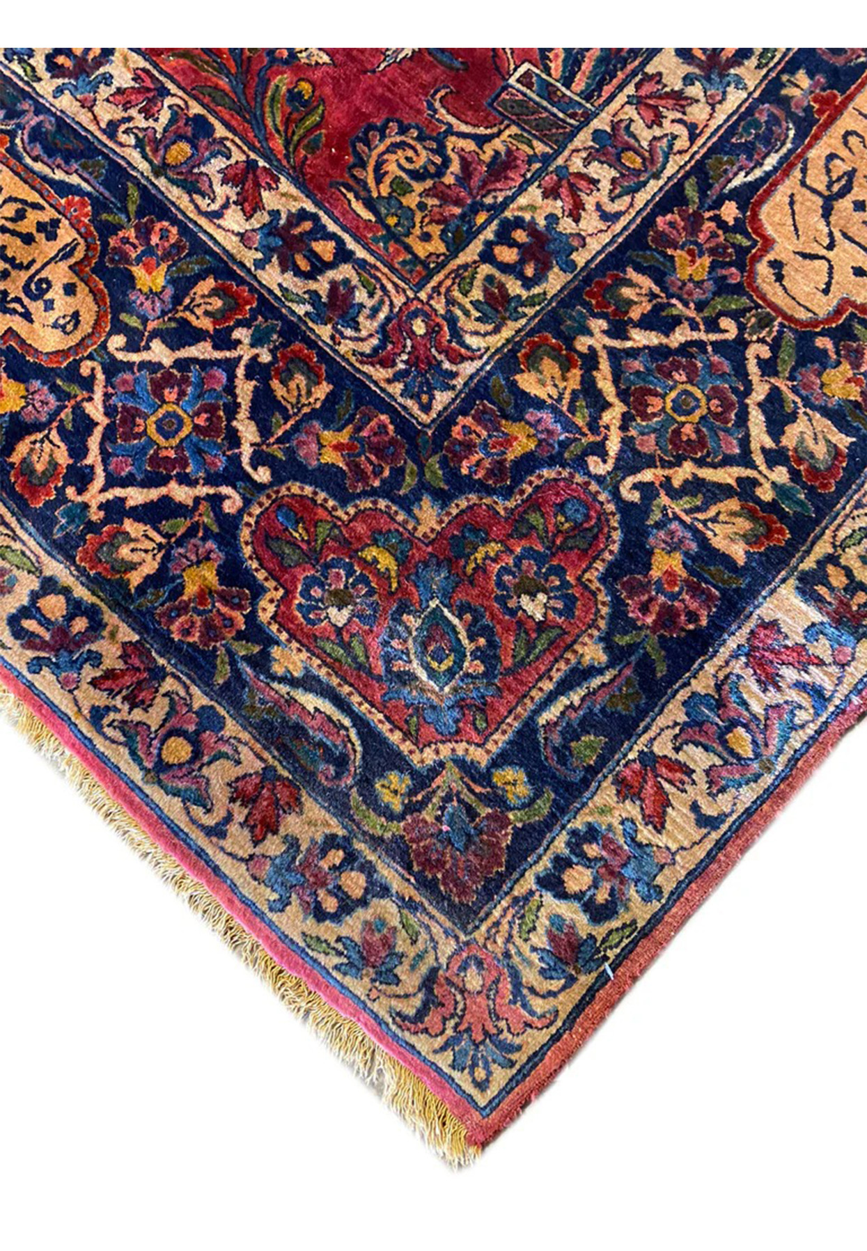 Corner detail of antique Persian Sarough rug with red field and gold poetry cartouche