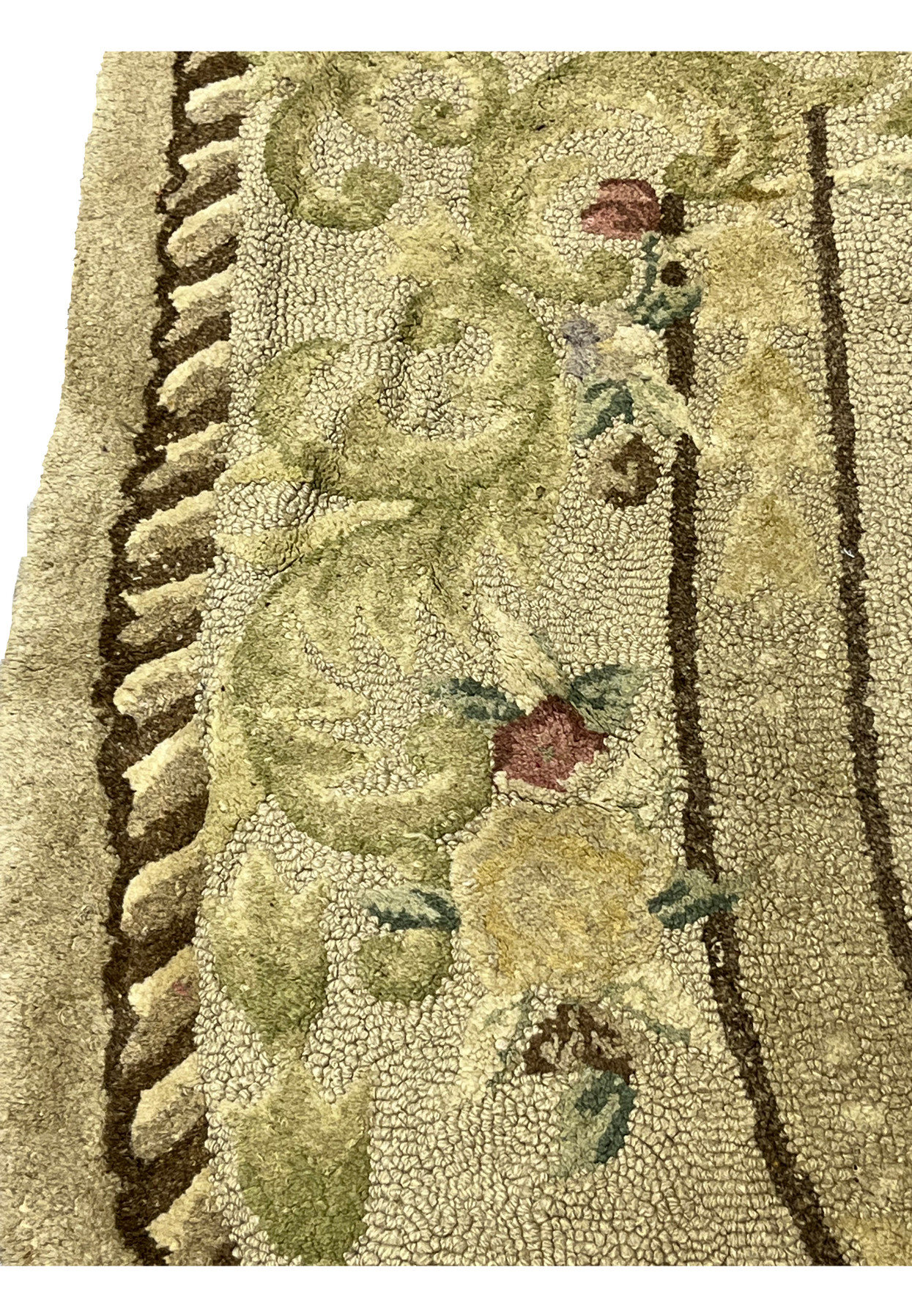 Border closeup with rose bloom, green scrollwork and brown outline, antique hand-hooked oval rug detail