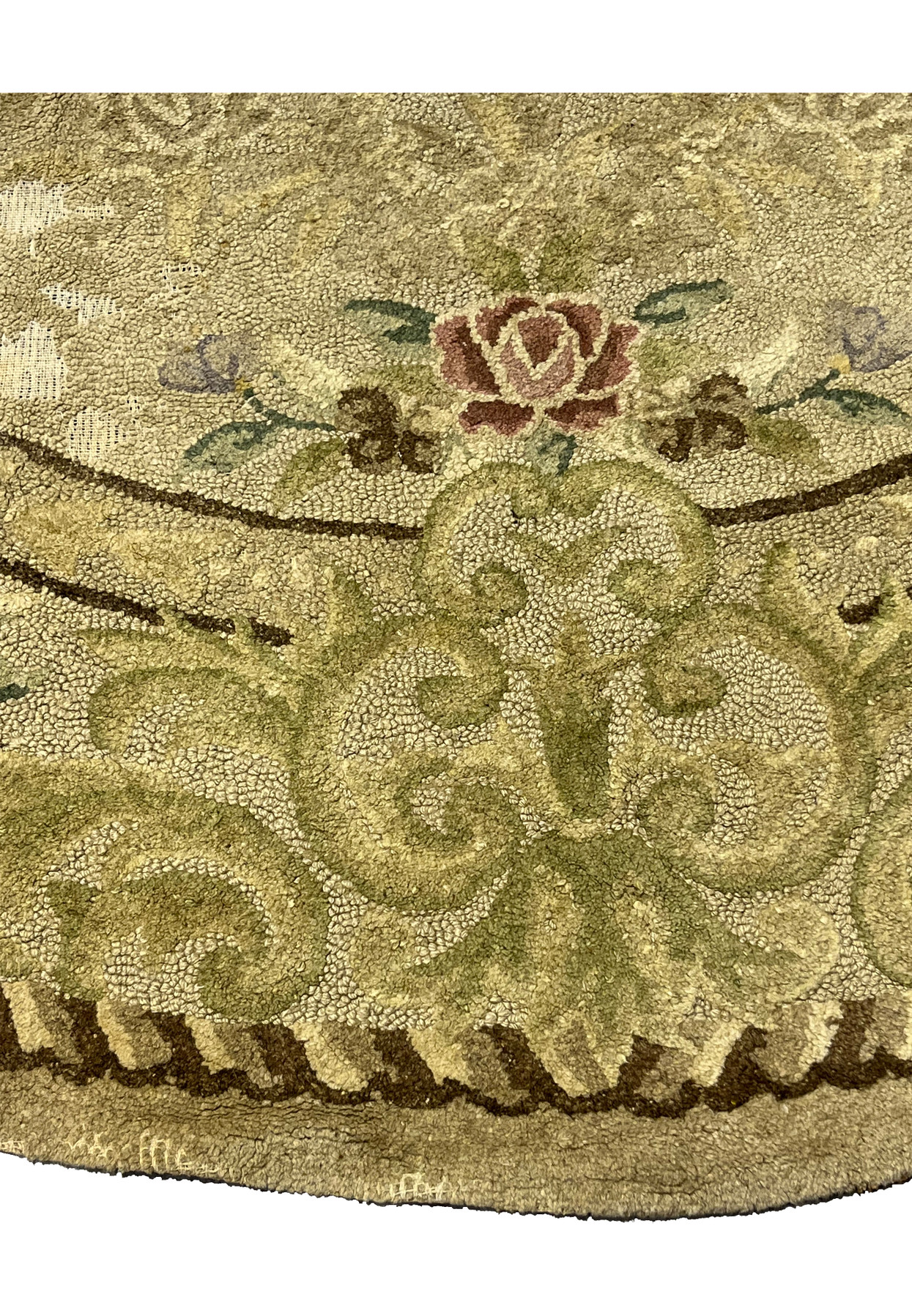 Scrolled acanthus and rose border in sage green and mauve, detail of antique hand-hooked oval floral rug