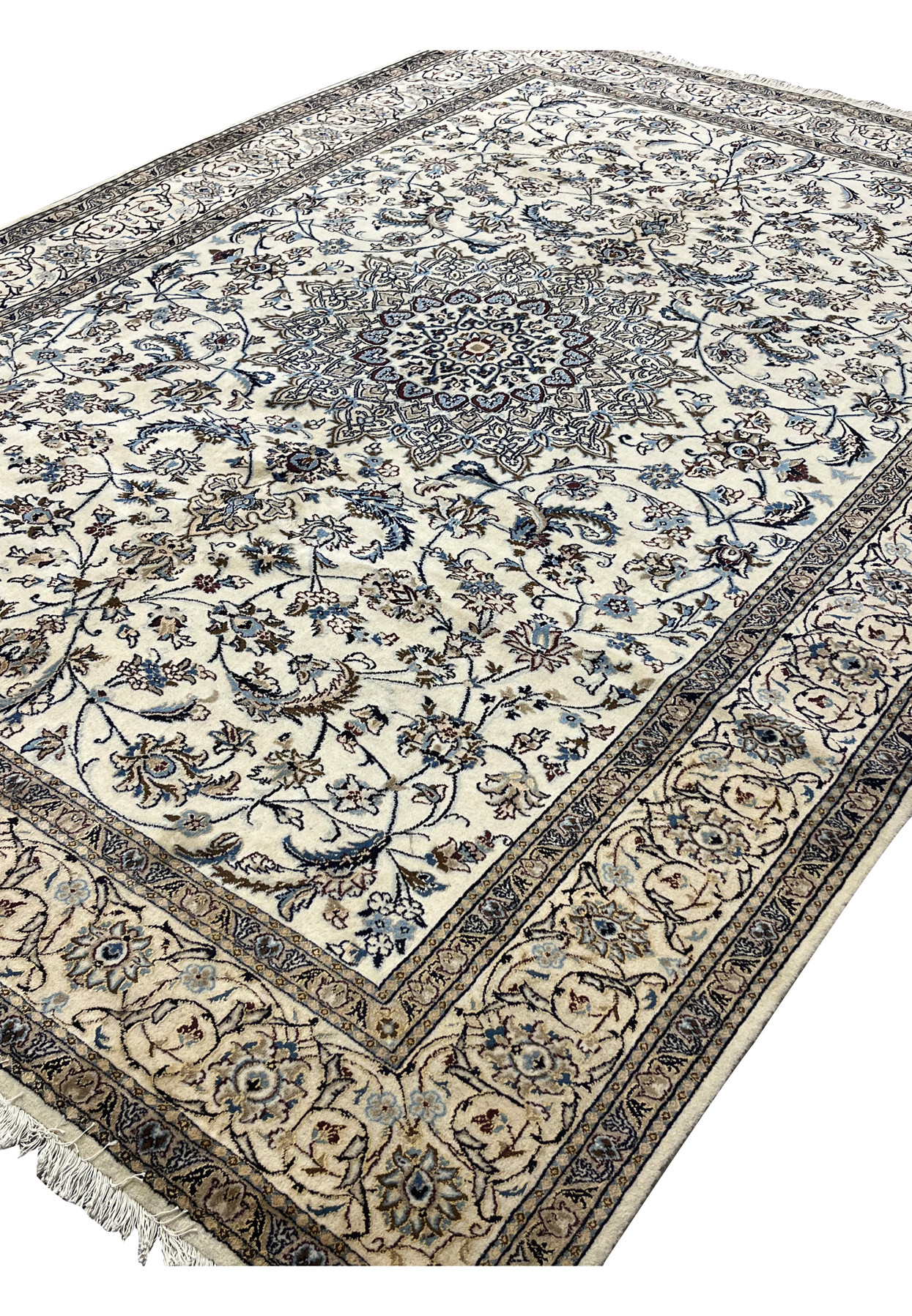Angled full view of the 6x10 Nain rug highlighting the calm ivory and blue color scheme