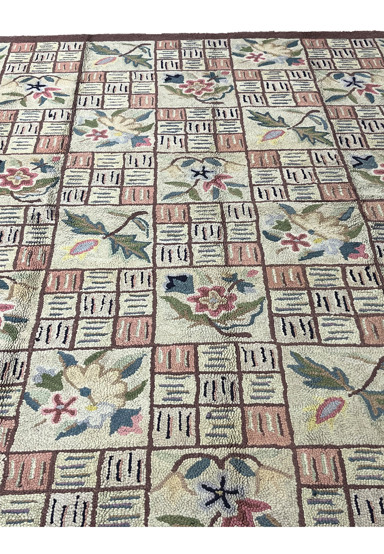 Detailed look at the hooked loop texture with pastel basket weave squares and flowers