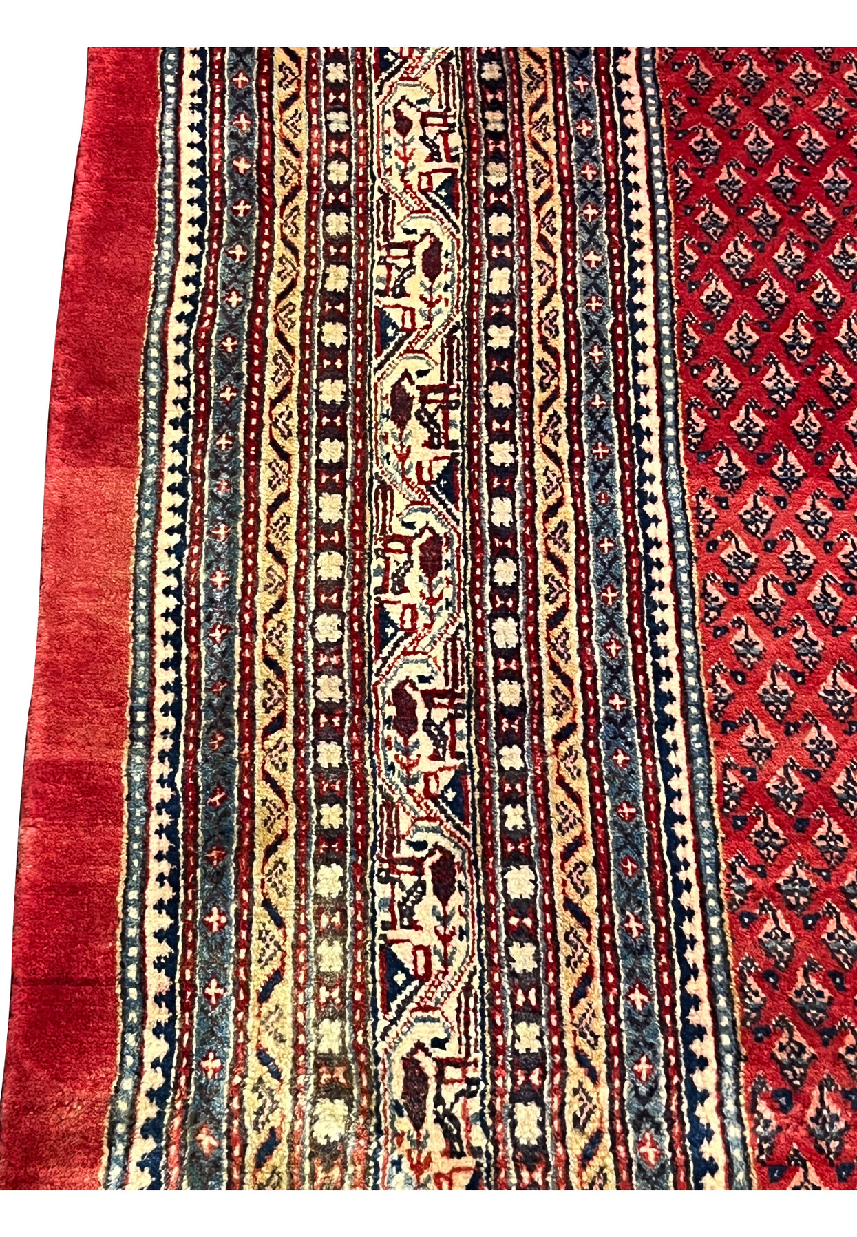 Close detail of the ivory camel border band flanked by navy and gold running stripes