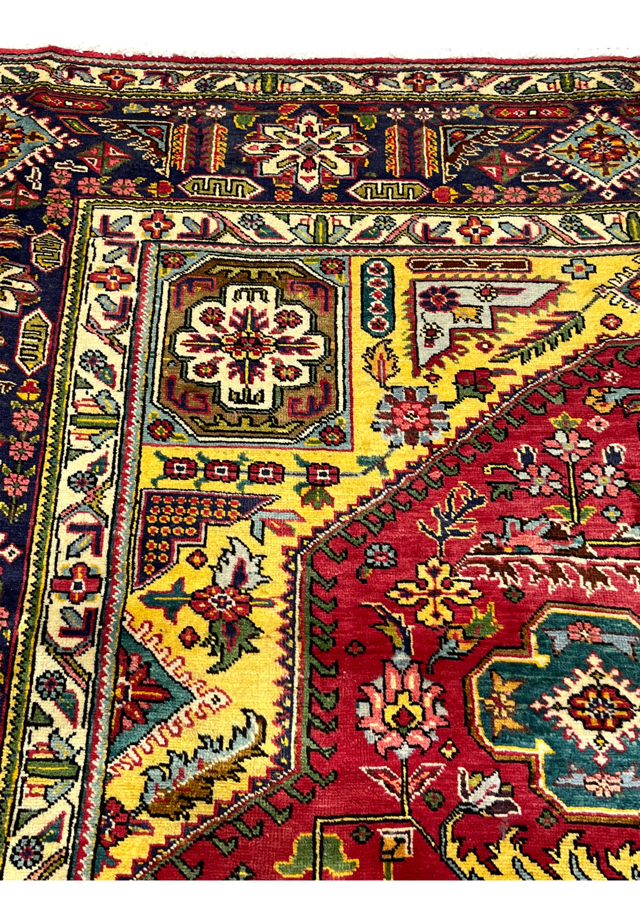 Inner ivory guard border of the Tabriz with vine, blossom, and palmette motifs in red and teal