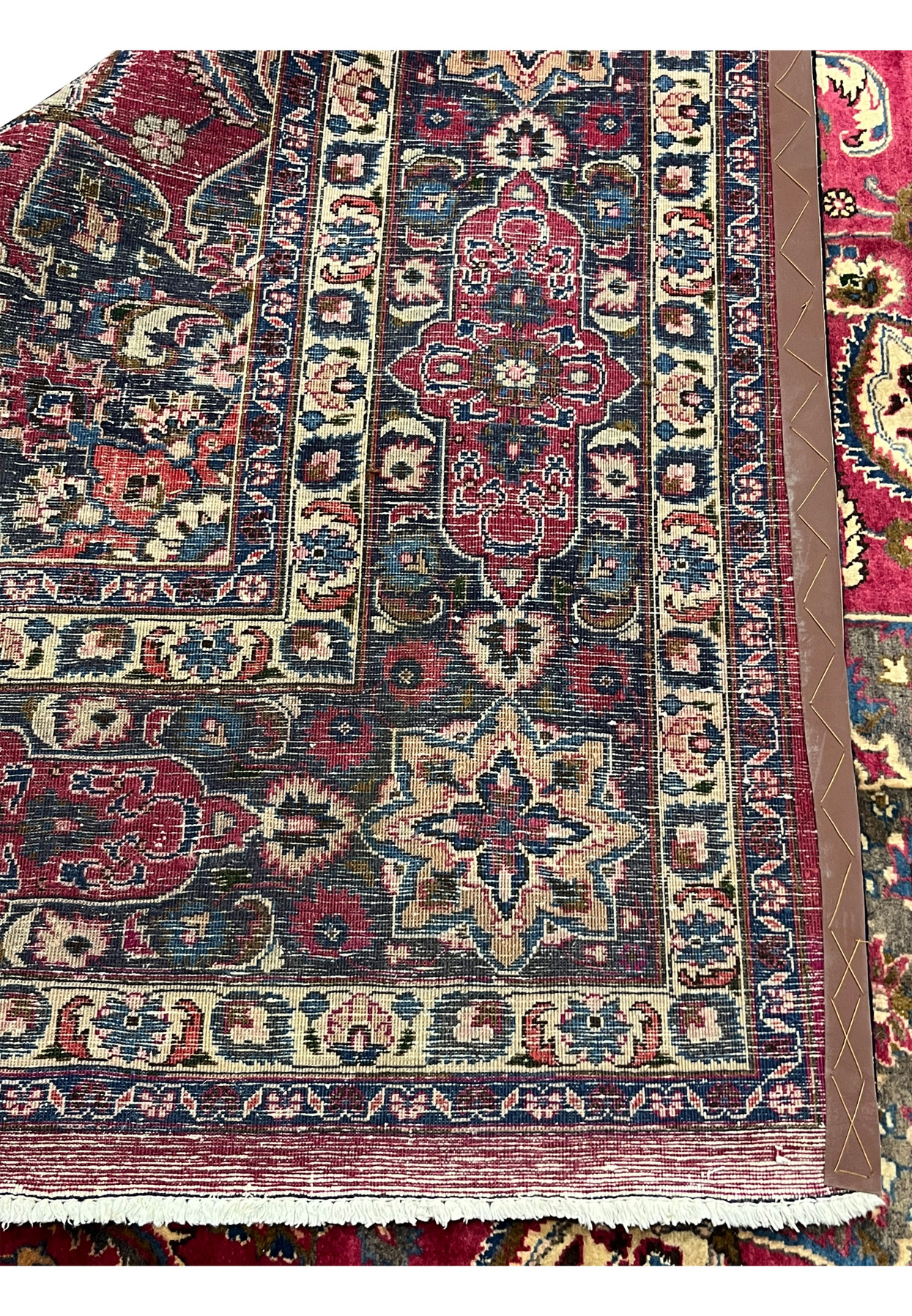 Reverse of the hand-knotted Persian Mashad showing the dense even weave and cotton foundation