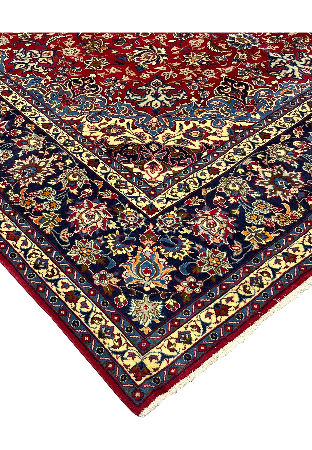 10 x 16 Persian Najafabad rug corner where the red field, ivory spandrel, and navy border meet