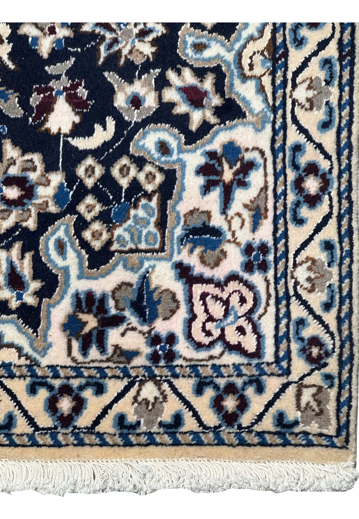 Ivory main border with a meandering vine of flowers and a soft tan corner, authentic handmade Nain detail