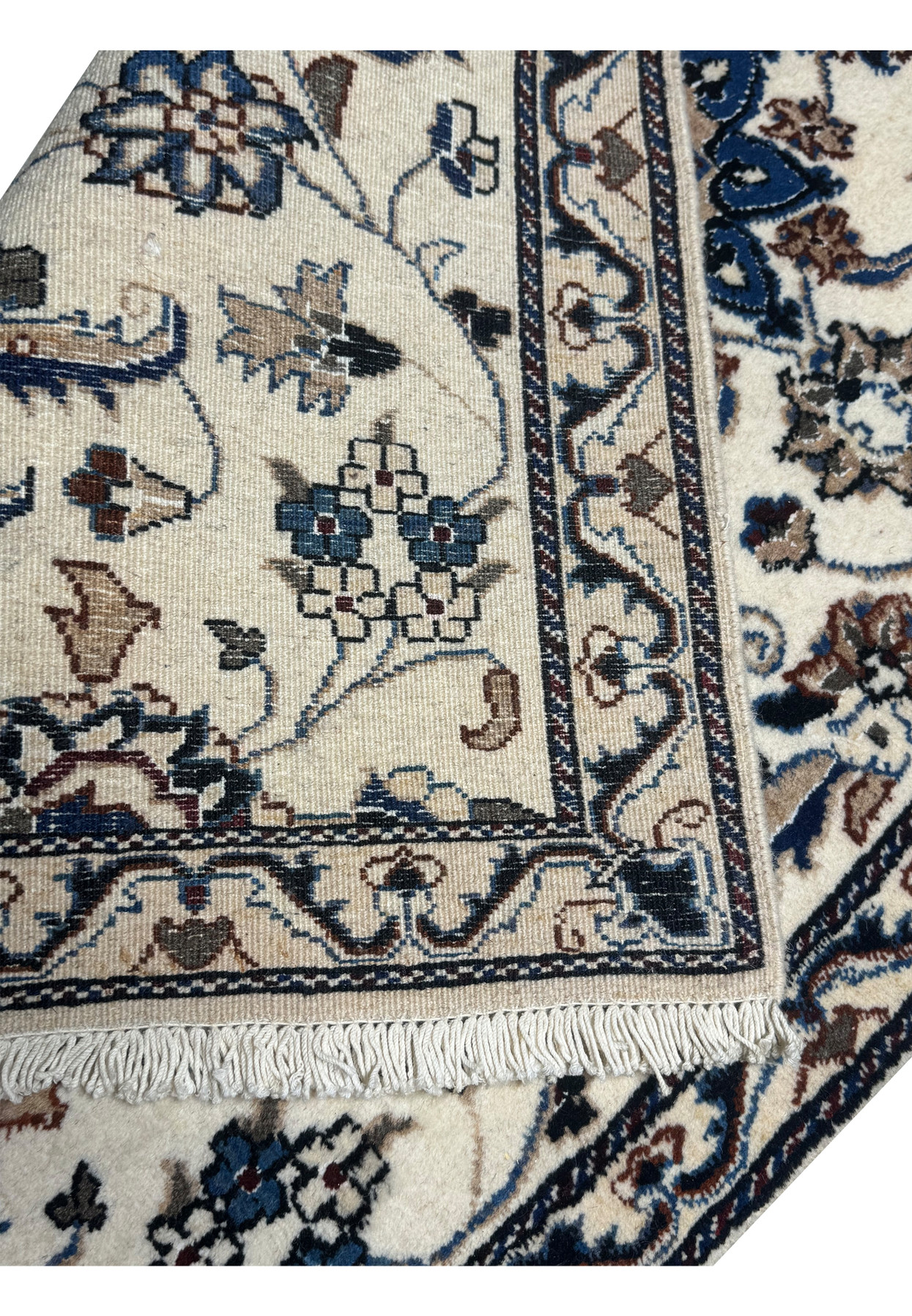 Reverse of the Nain rug showing the fine even knot count on a cotton foundation